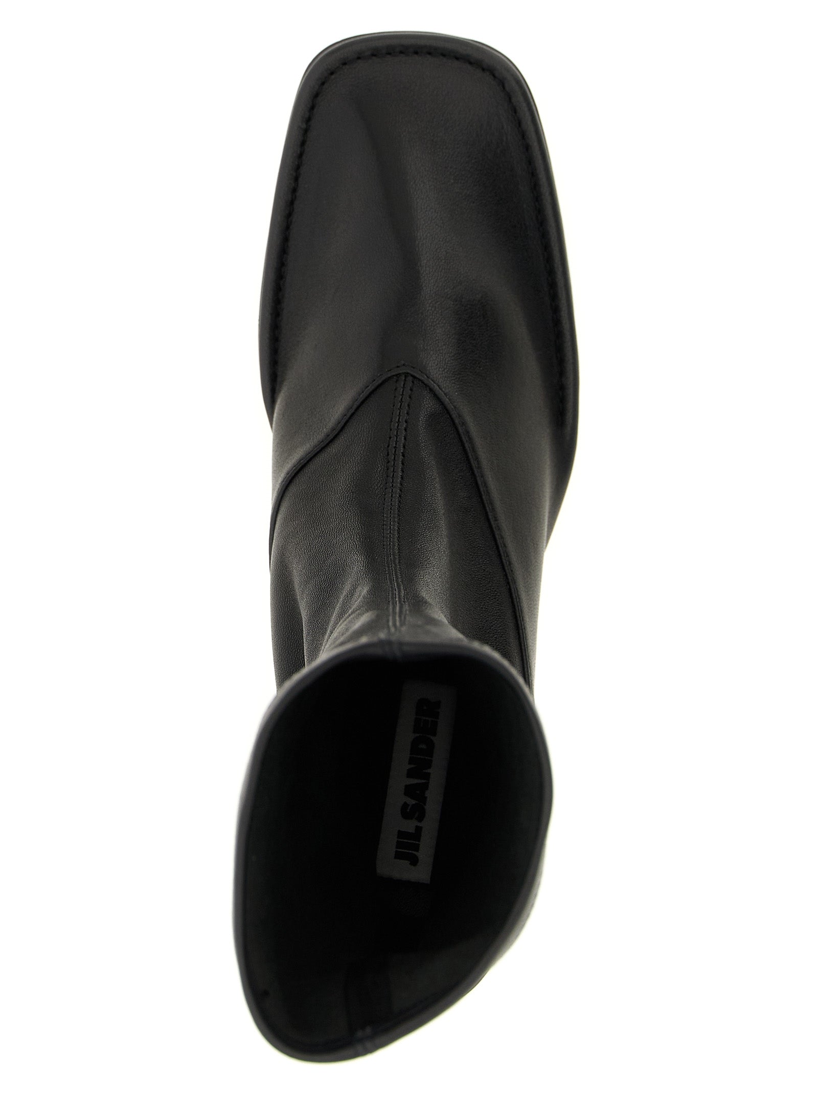 Experience the allure of Jil Sander's Black Lamb Leather Ankle Boots, where exquisite craftsmanship meets modern elegance, perfect for the discerning fashion connoisseur.