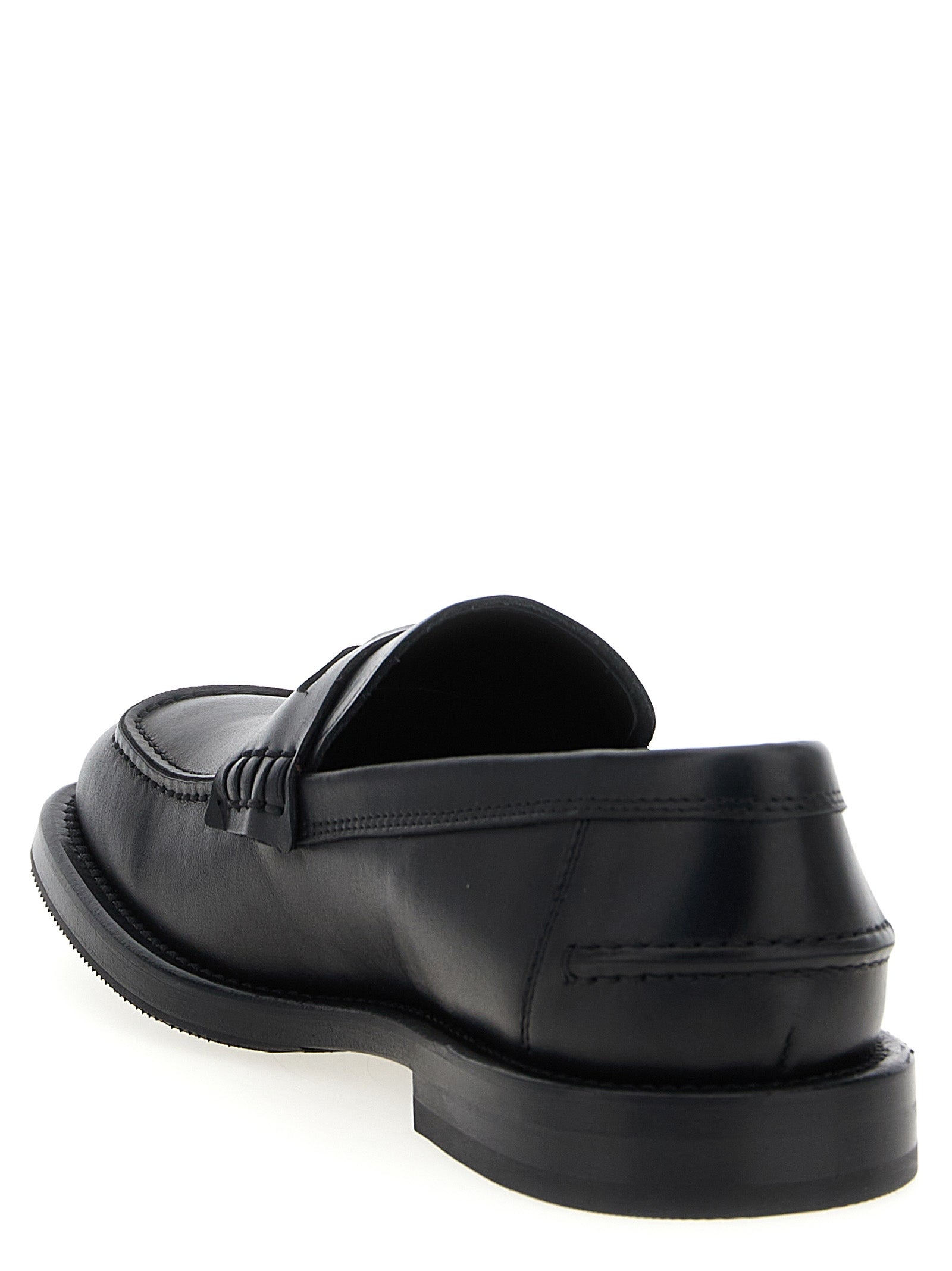 Indulge in the exquisite Moschino Black Velvet Leather Slip-On Loafers, where Italian craftsmanship meets bold design, elevating your style with timeless elegance.
