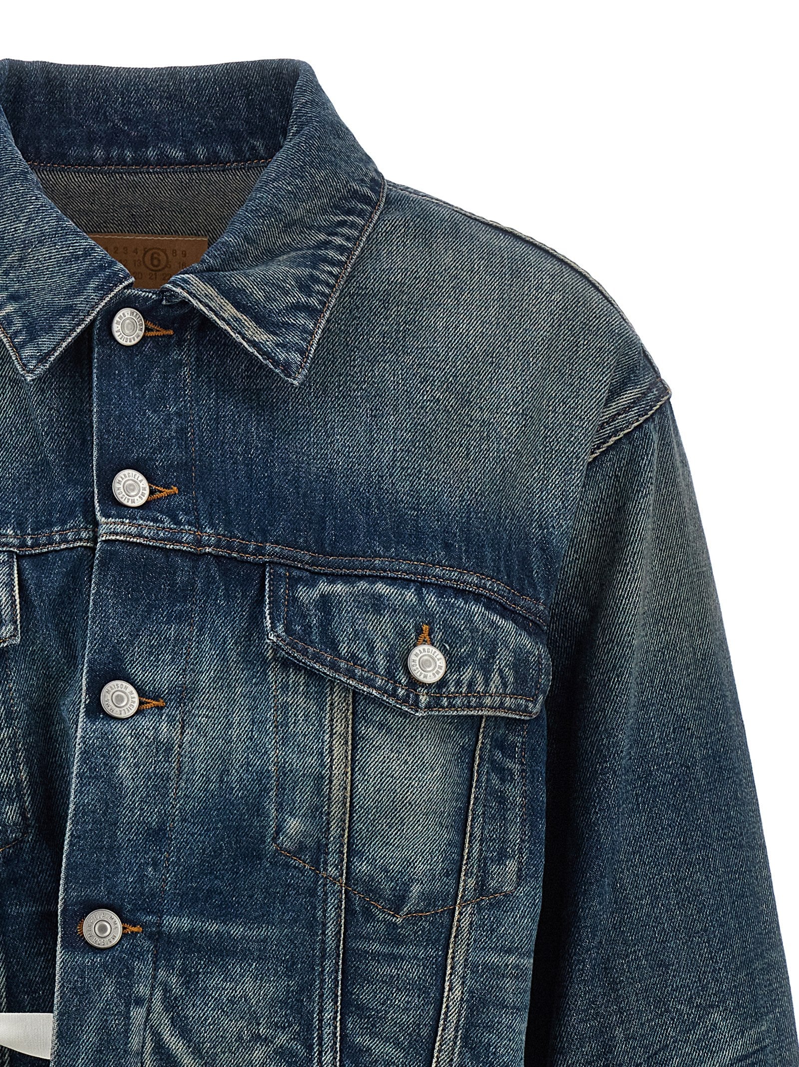 Experience the audacious elegance of the MM6 Maison Margiela Blue Cotton Denim Jacket, a masterpiece of avant-garde design, perfect for those who embody sophistication and style.