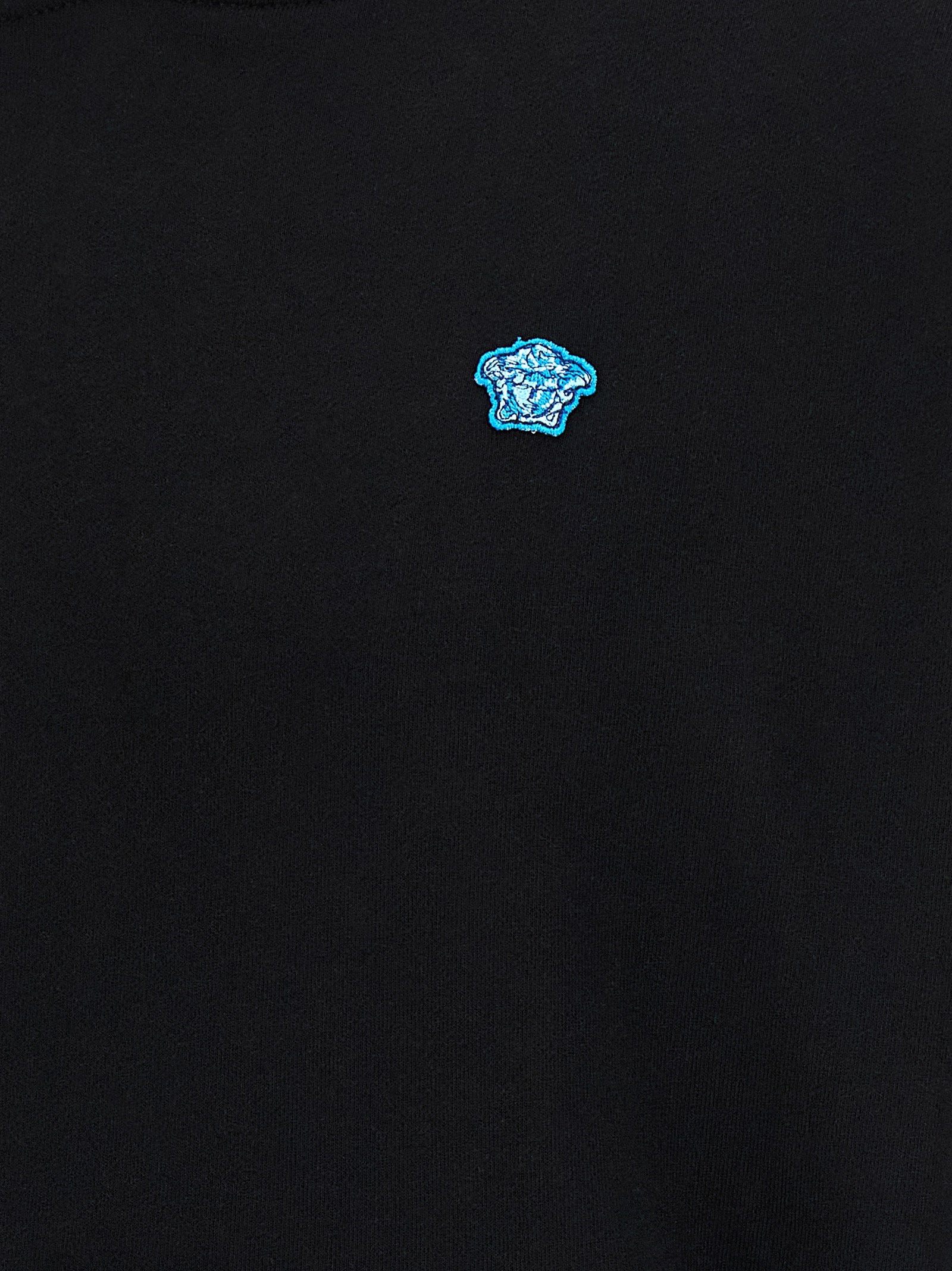 Elevate your wardrobe with the Versace Black Cotton Sweatshirt, a luxurious blend of comfort and style, featuring the iconic Medusa patch for timeless elegance.