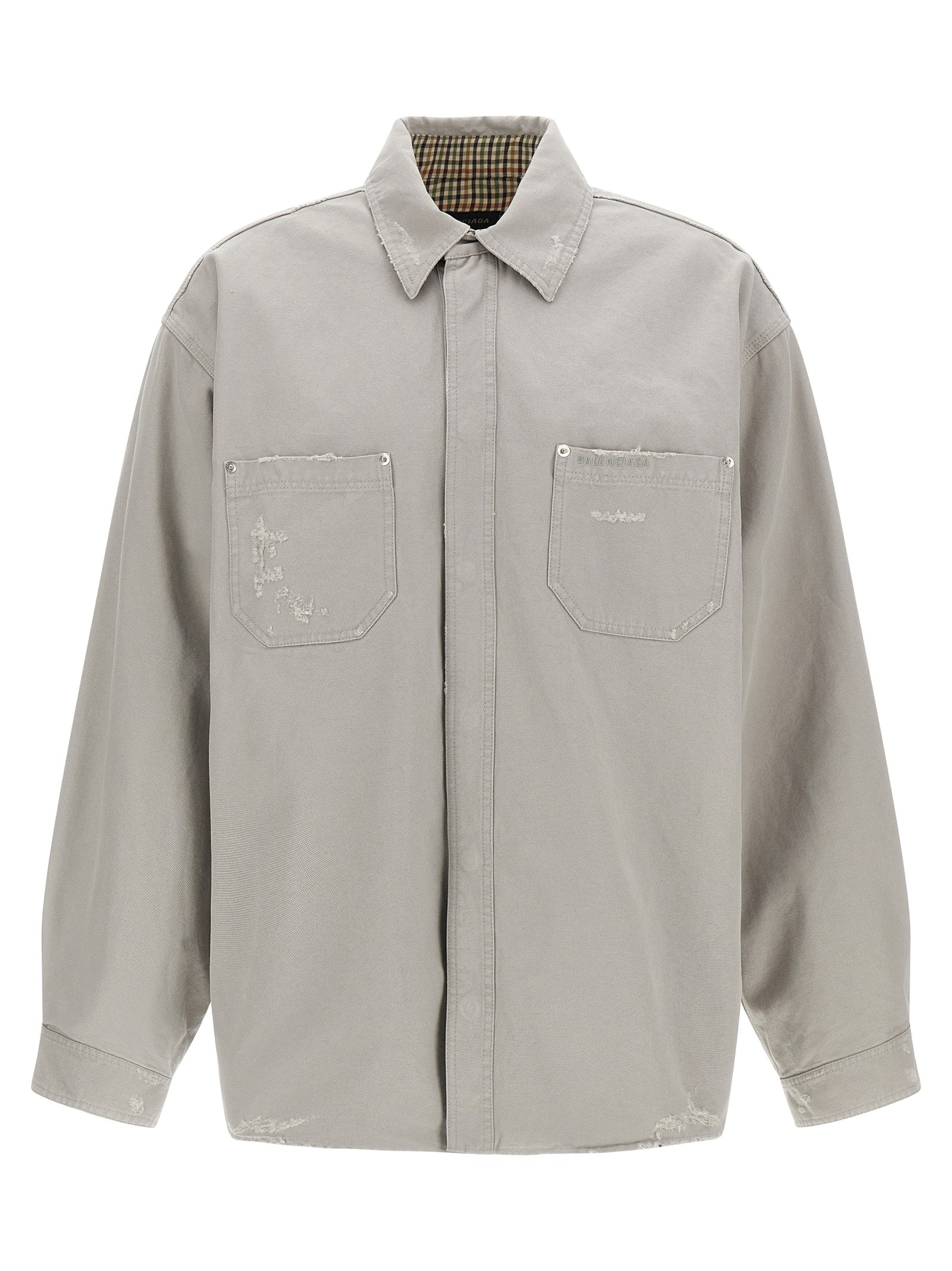 Elevate your style with the Balenciaga Gray Cotton Blouse, a luxurious blend of rugged charm and refined elegance, crafted for the discerning fashion connoisseur.