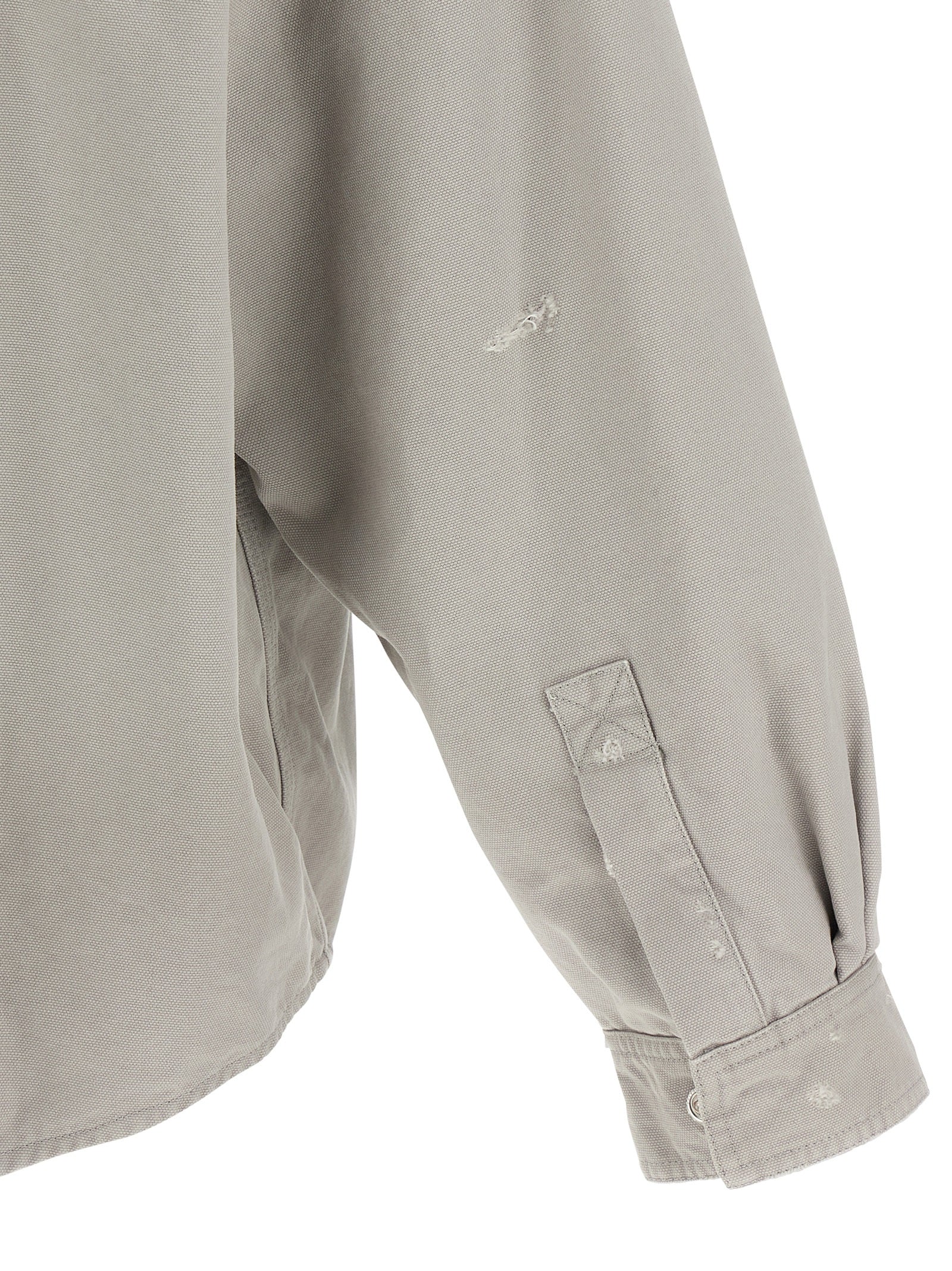 Elevate your style with the Balenciaga Gray Cotton Blouse, a luxury streetwear masterpiece crafted from heavy used-effect cotton, embodying sophistication and effortless elegance.