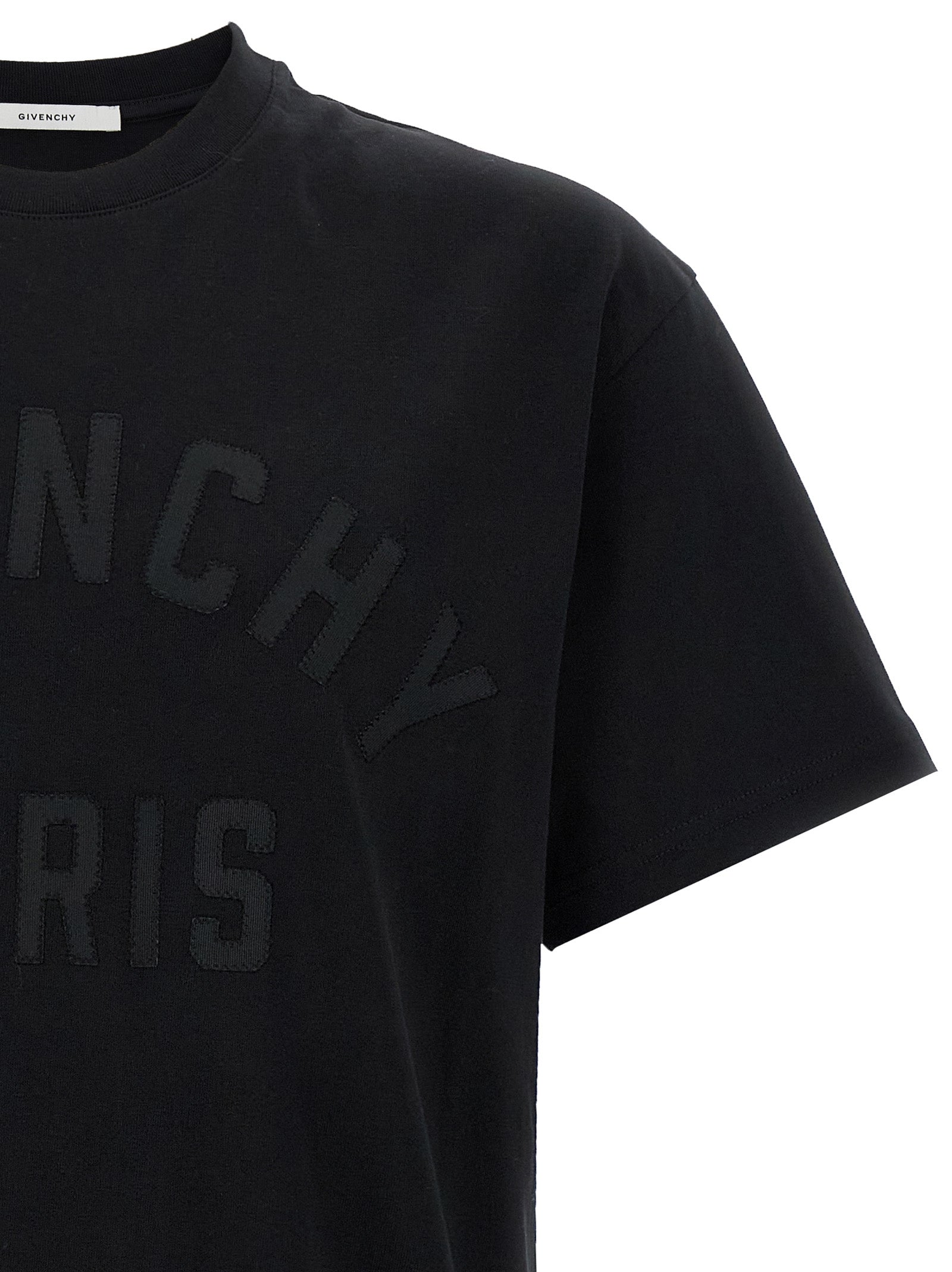 Elevate your wardrobe with the Givenchy Black Cotton T-Shirt, a luxurious staple crafted from 100% cotton, embodying timeless elegance and avant-garde design.