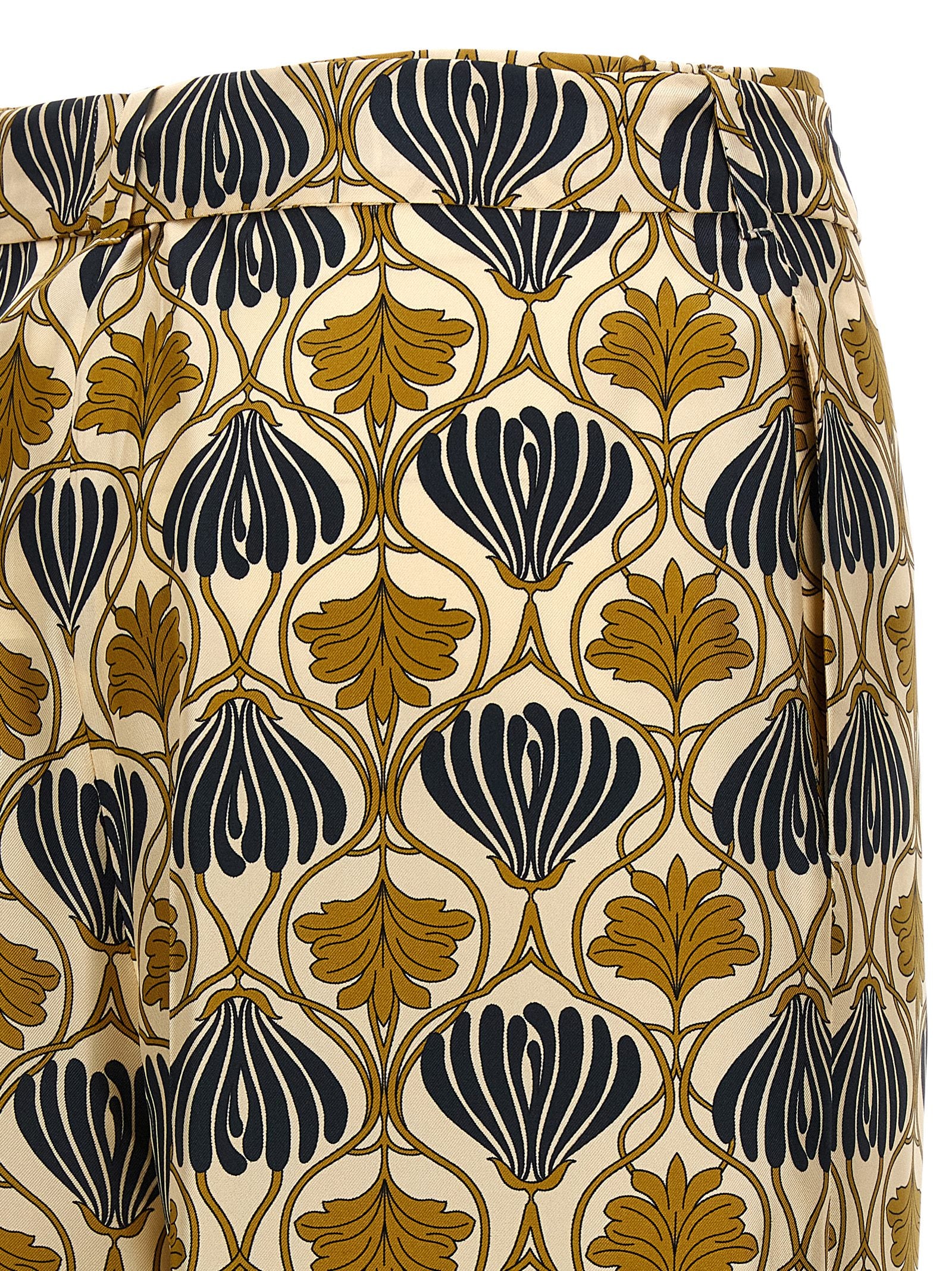 Discover the Max Mara Bicolor Silk Casual Pants, where exquisite silk meets sophisticated design, embodying timeless elegance for the discerning fashionista.
