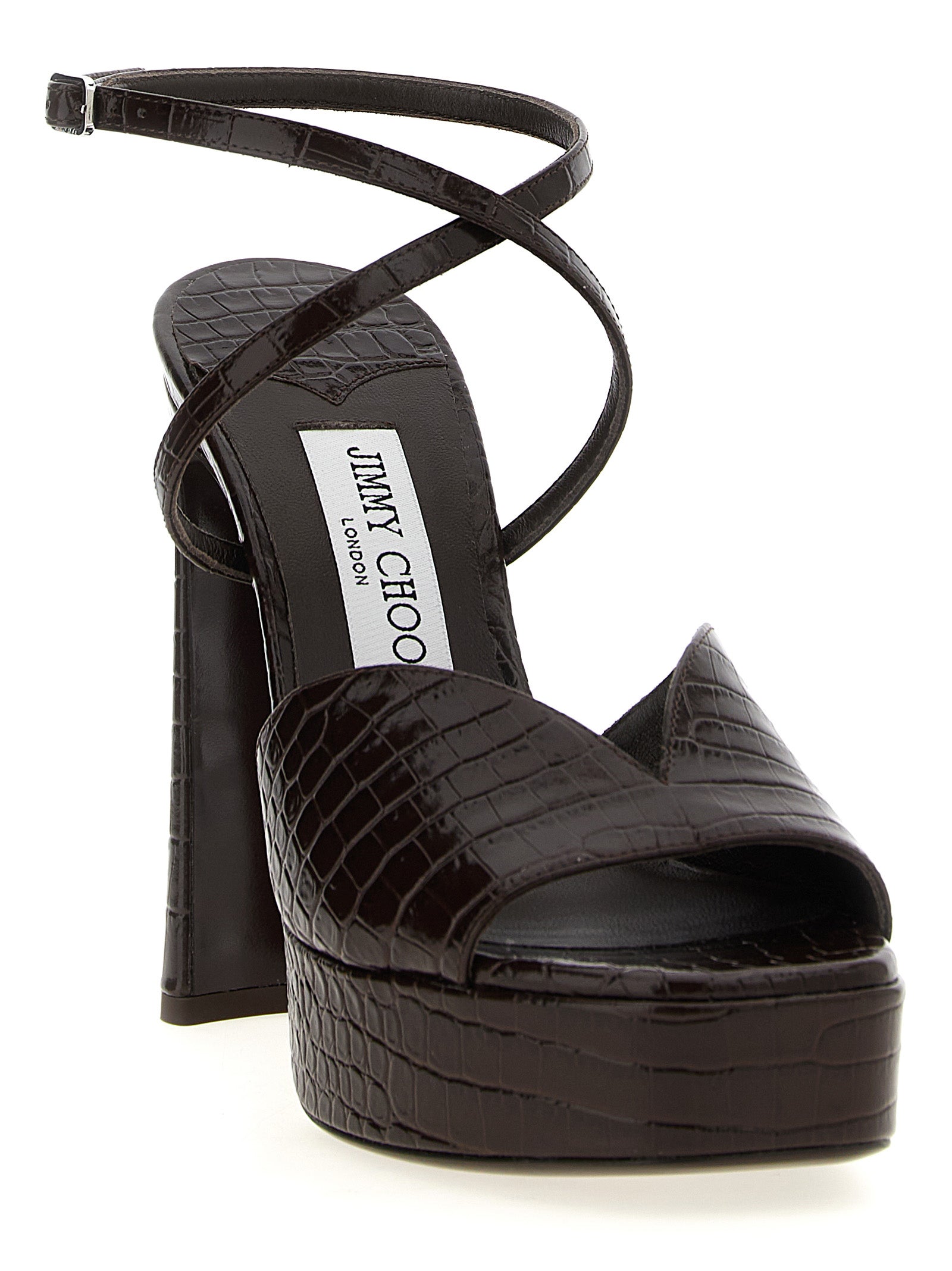 Elevate your elegance with Jimmy Choo's Karli Brown Leather Stiletto Heel Sandals, crafted from luxurious crocodile-print leather for a captivating presence.