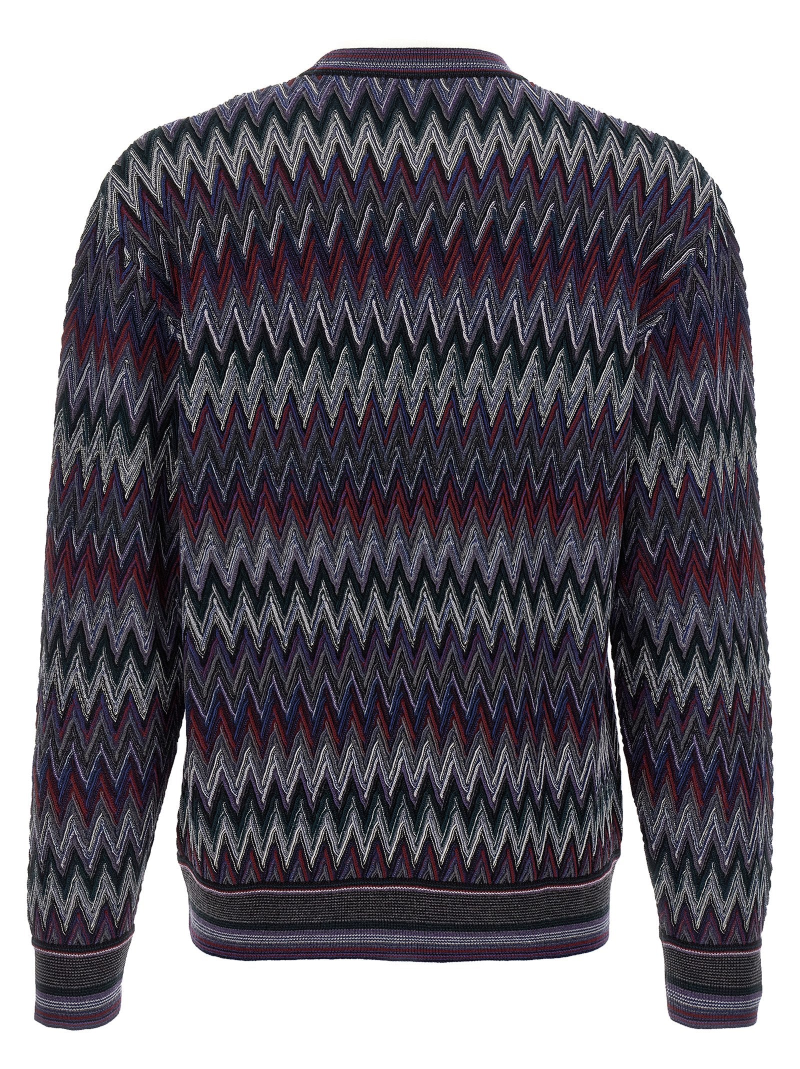 Indulge in the Missoni Blue Wool Cardigan, a masterpiece of Italian craftsmanship, featuring a bold zigzag pattern that elevates your wardrobe with luxurious sophistication.