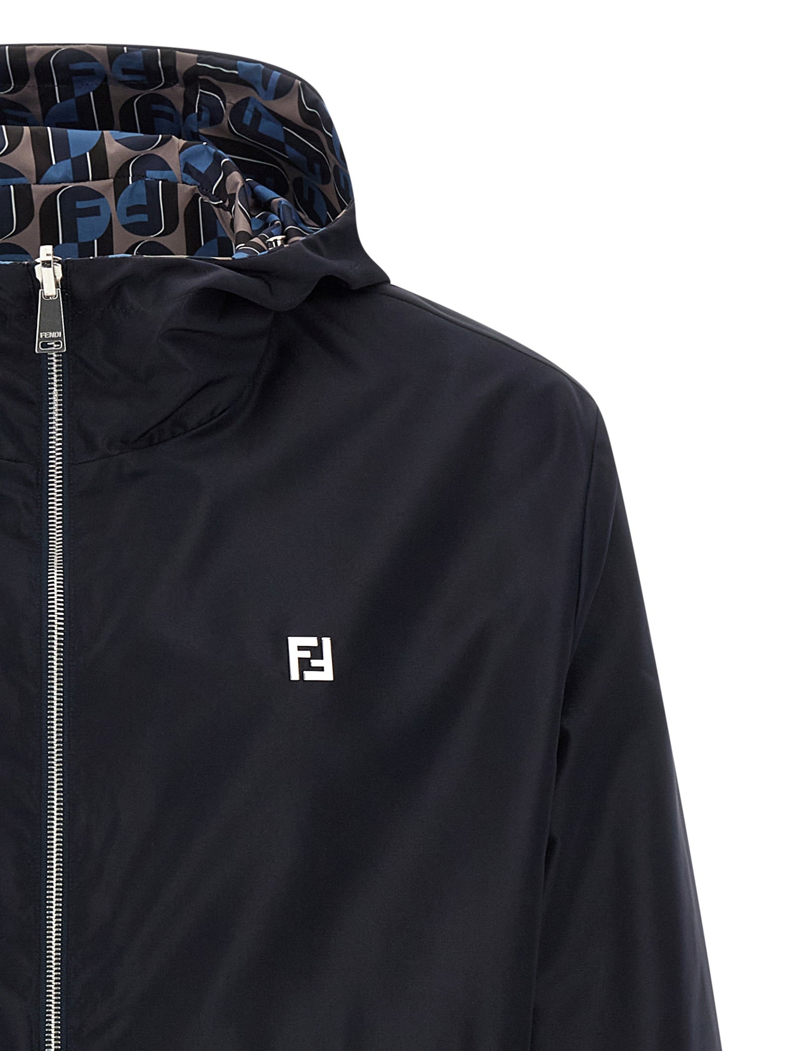 Elevate your style with the Fendi Blue Polyester Shell Jacket, a luxurious reversible windbreaker that embodies sophistication and versatility for the discerning individual.