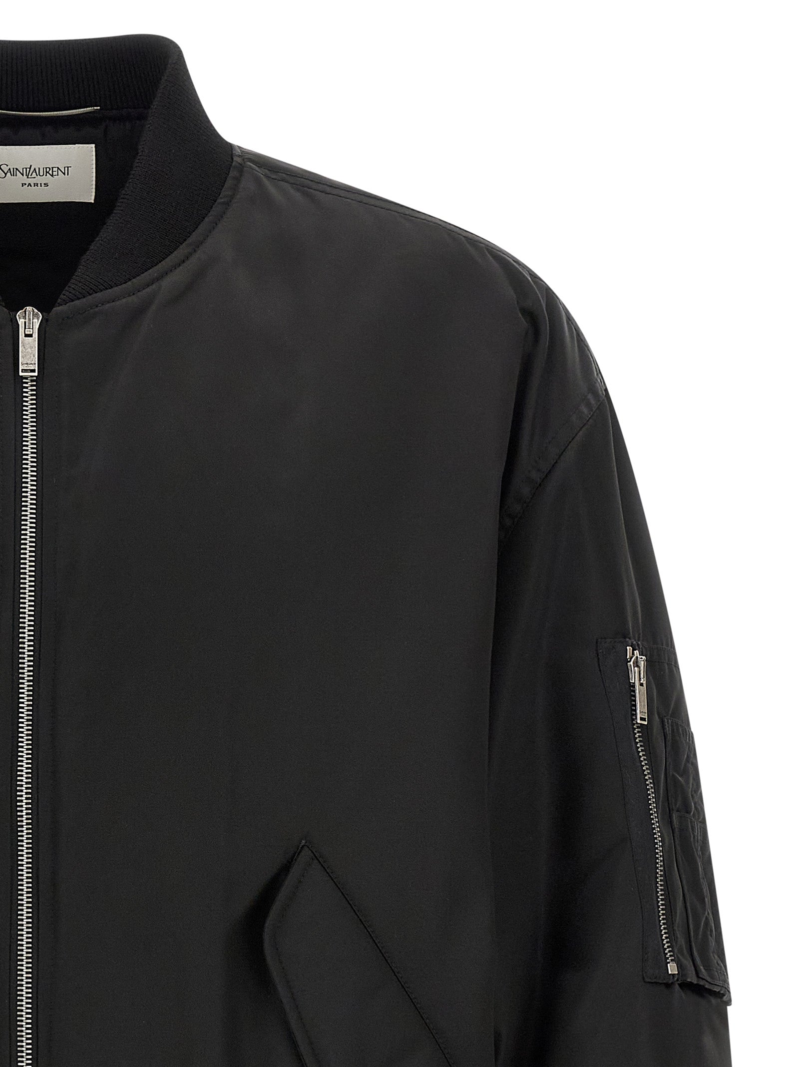Elevate your wardrobe with the Saint Laurent Black Polyamide Bomber, a luxurious Italian-made statement piece that embodies sophistication and timeless elegance.