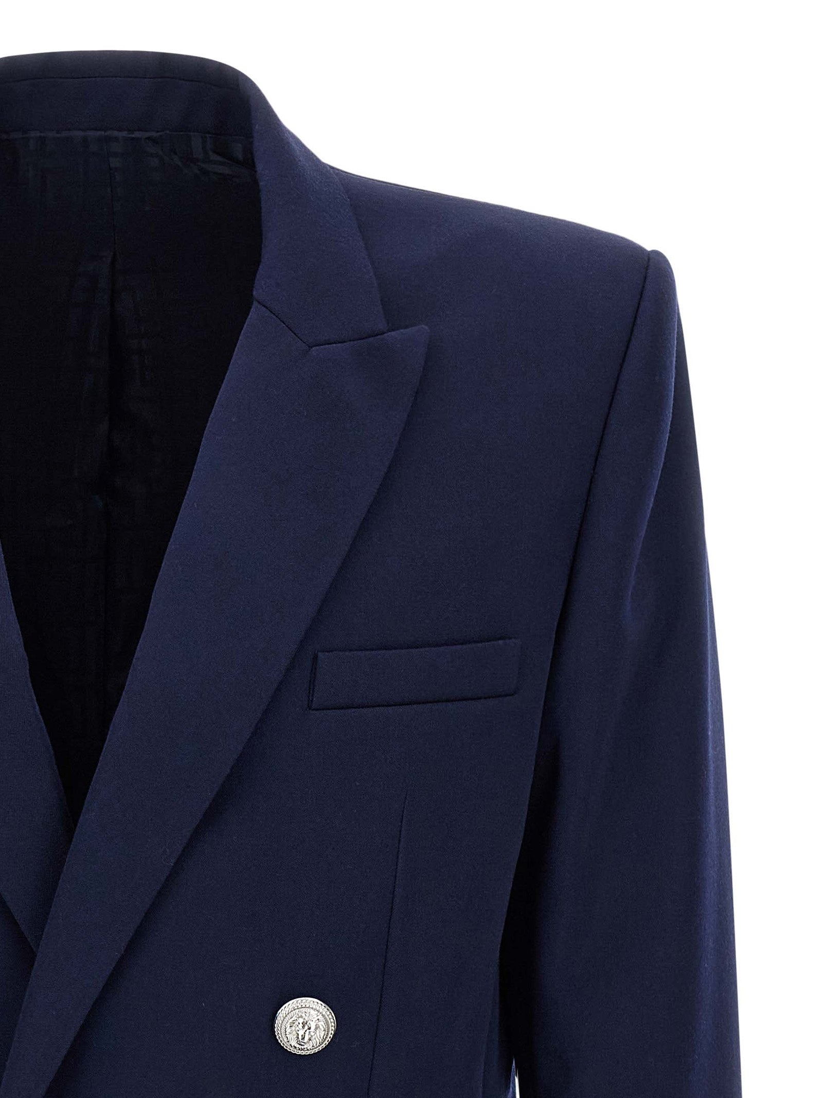 Elevate your wardrobe with the Balmain Blue Virgin Wool Blazer, a masterpiece of exquisite craftsmanship and timeless elegance, designed for those who command attention.