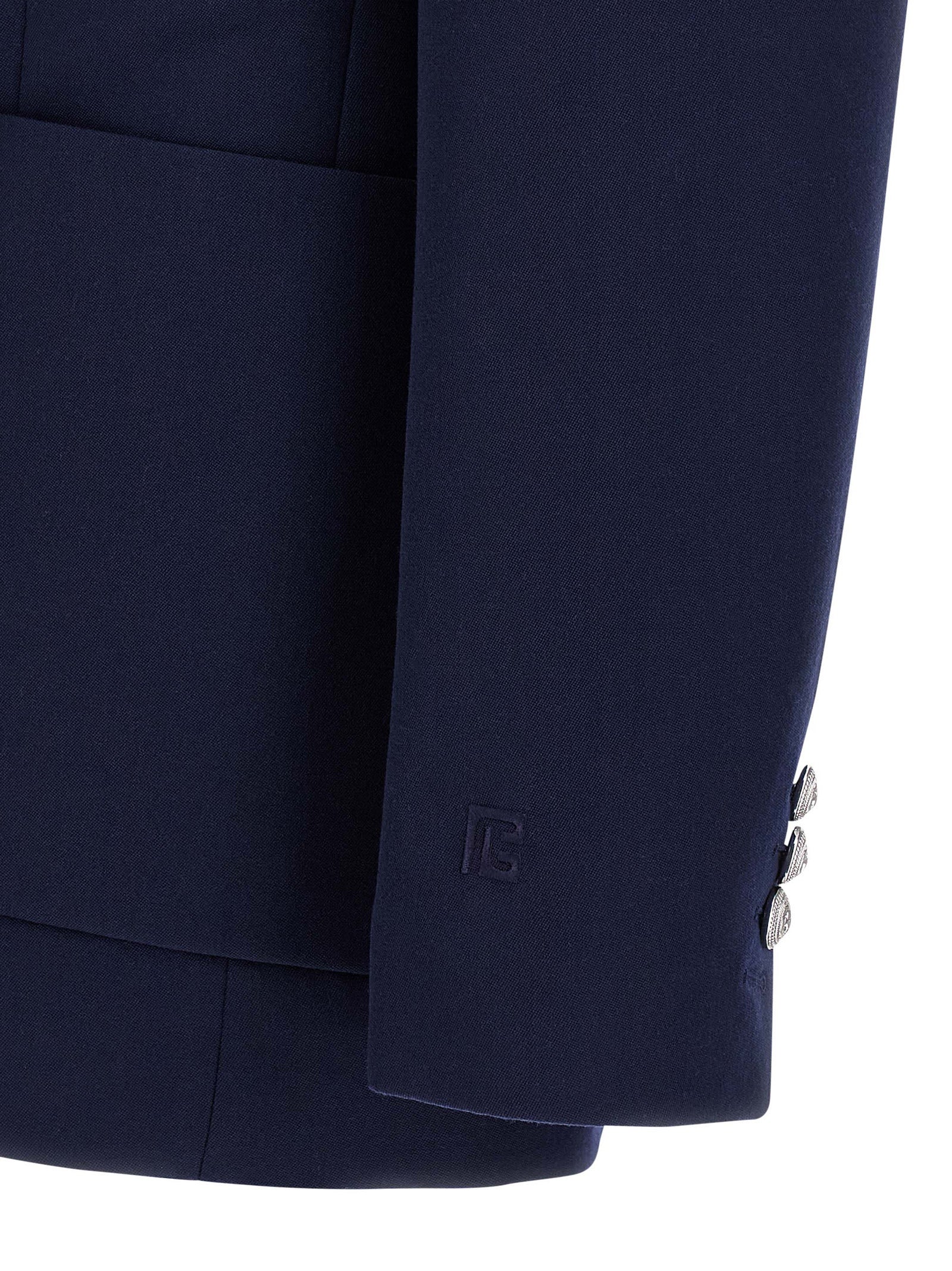 Elevate your wardrobe with the Balmain Blue Virgin Wool Blazer, a masterpiece of craftsmanship and elegance, perfect for those who command attention and embody sophistication.
