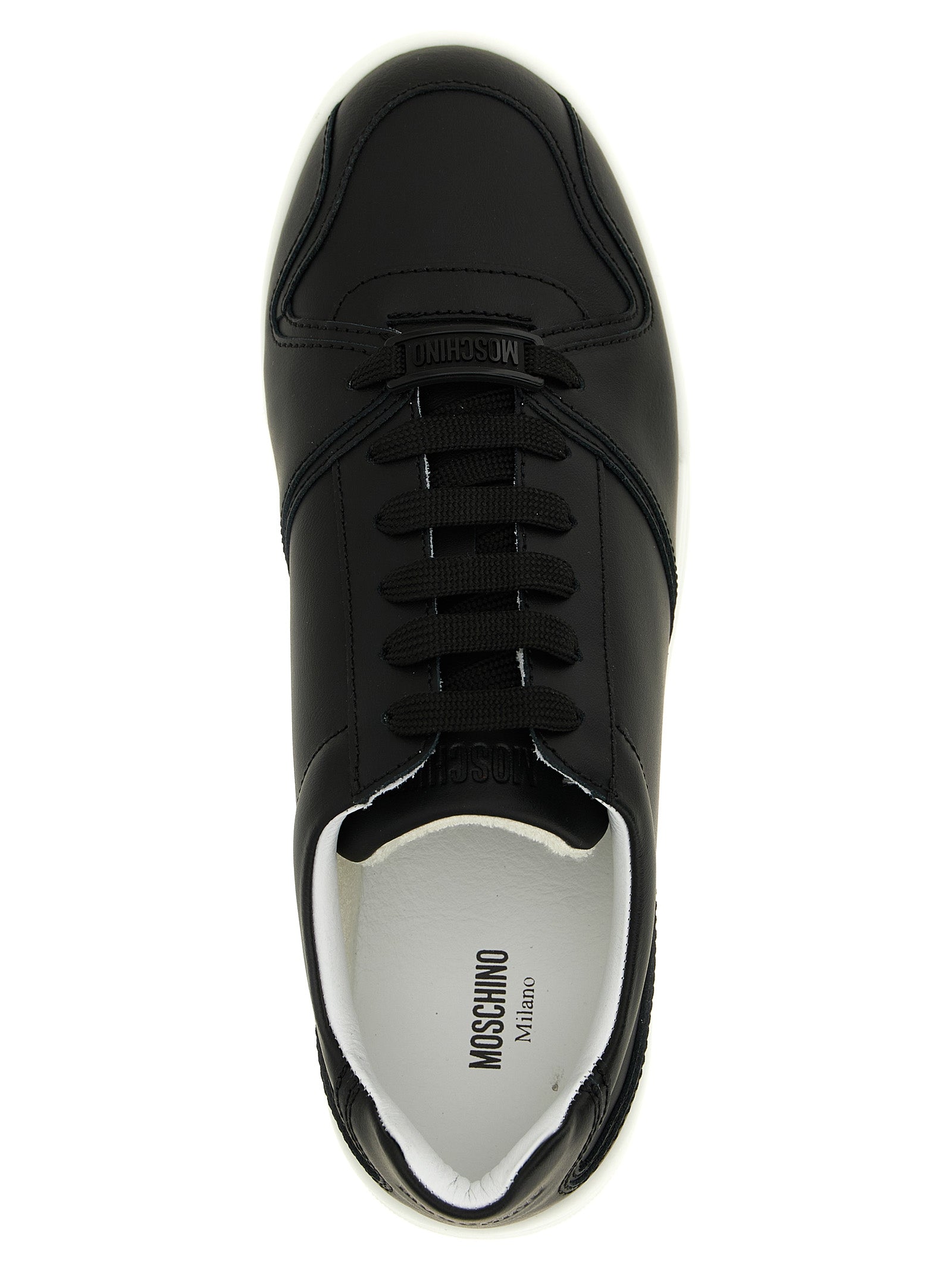 Step into the realm of luxury with Moschino Black Leather Low Top Sneakers, where Italian craftsmanship meets timeless elegance, perfect for the discerning individual.