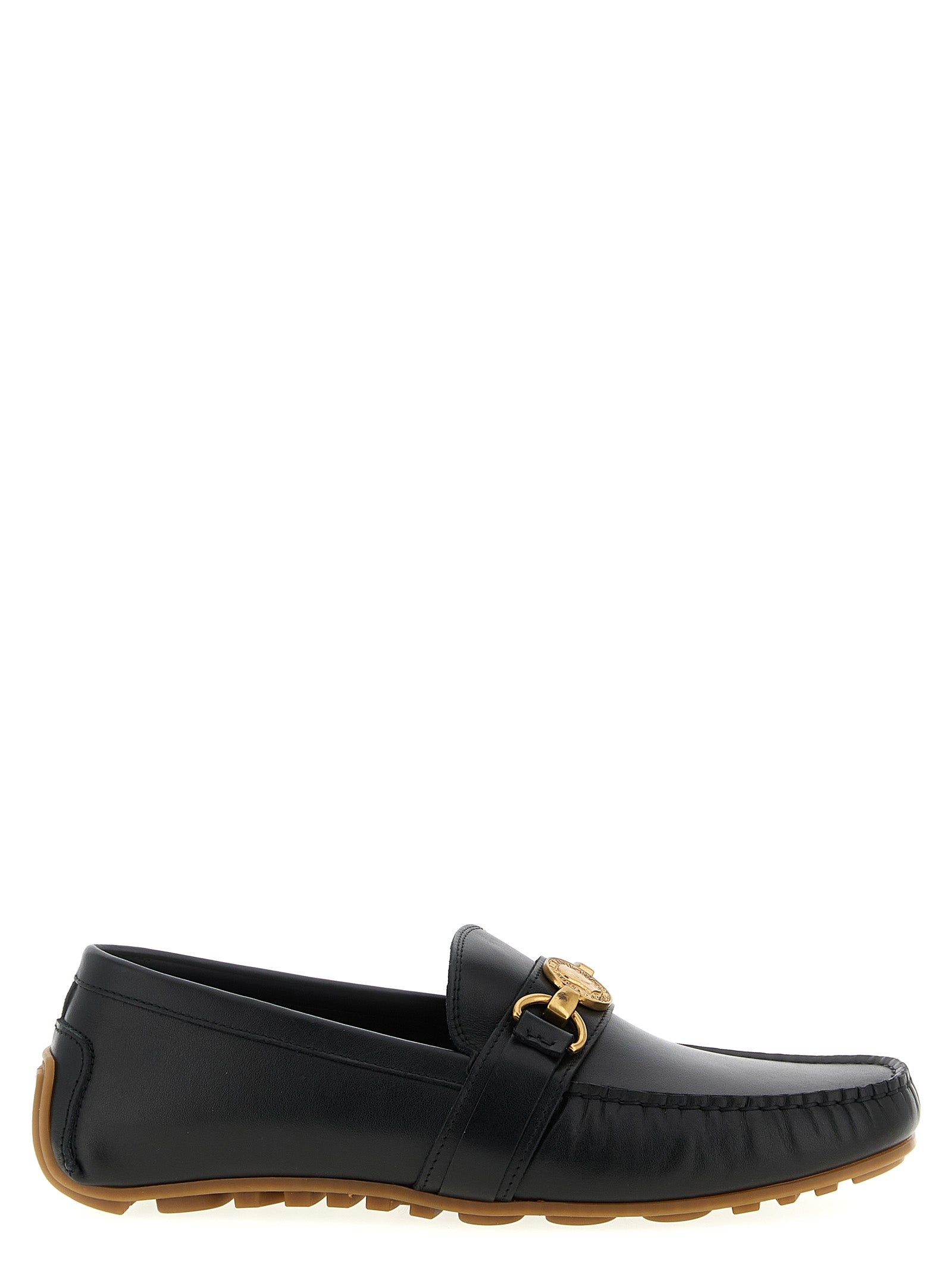 Indulge in the exquisite Moschino Black Leather Slip-On Loafers, where timeless elegance meets modern craftsmanship, perfect for those who command attention and embody sophistication.