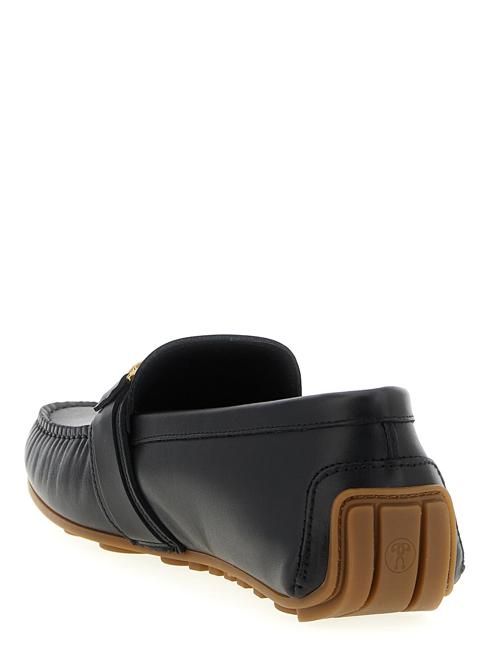 Elevate your elegance with Moschino Black Leather Slip-On Loafers, where exquisite craftsmanship meets timeless luxury, perfect for the discerning individual.