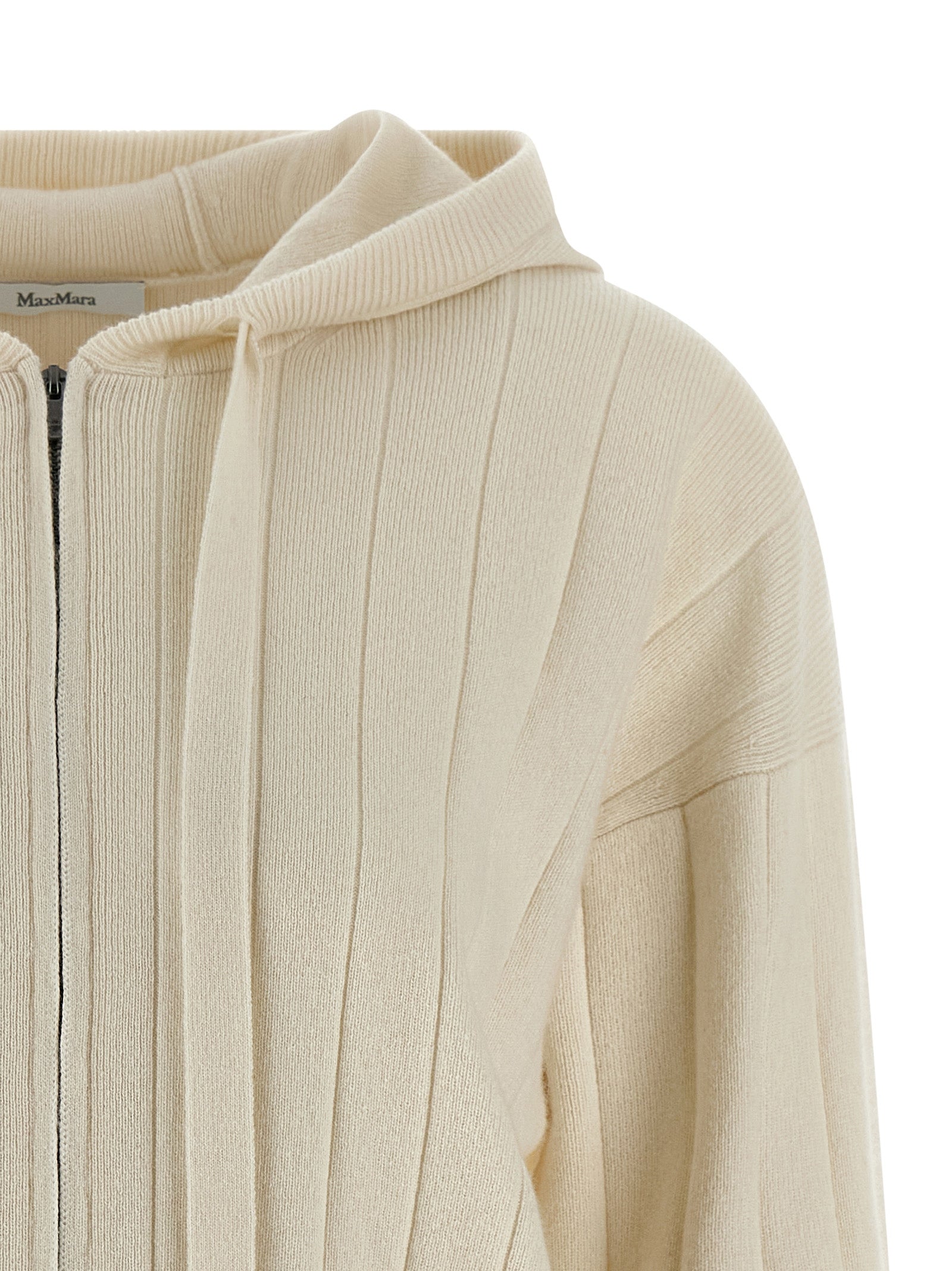 Elevate your wardrobe with the Max Mara White Cashmere Cardigan, a luxurious blend of sophistication and comfort, perfect for the discerning fashion connoisseur.