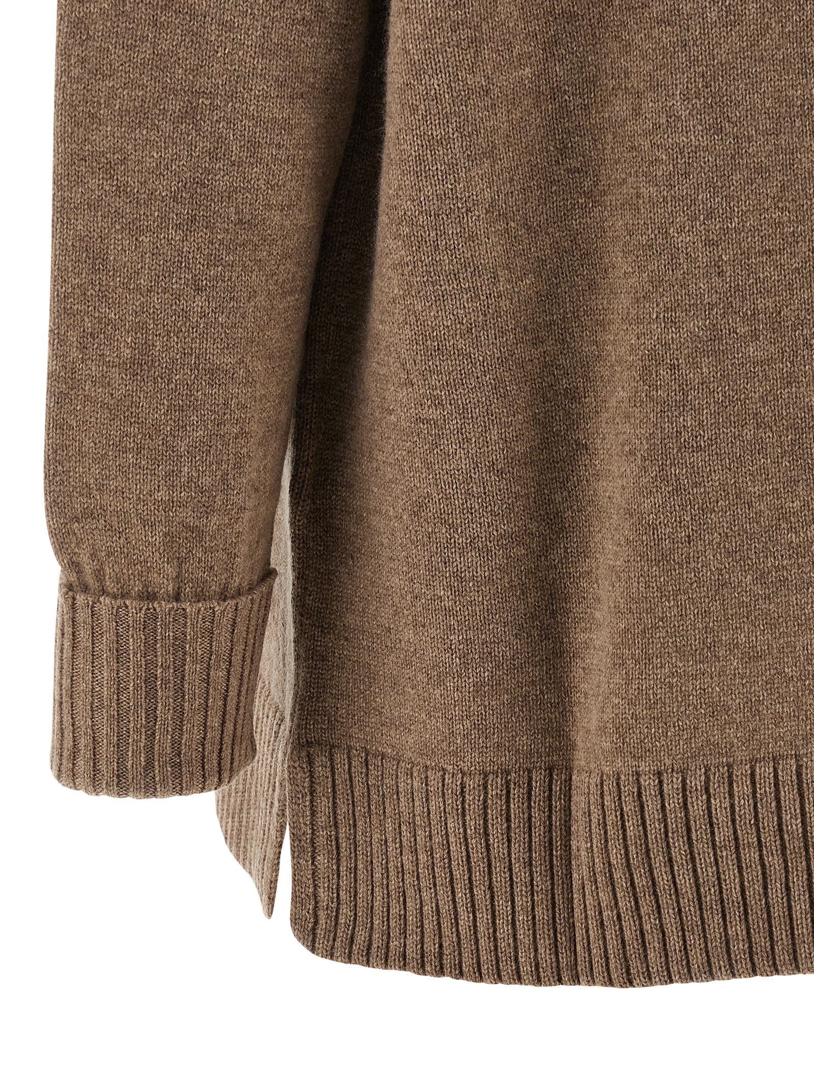 Indulge in the Max Mara Brown Cashmere Cardigan, a masterpiece of artisanal luxury, crafted from the finest cashmere for timeless elegance and effortless sophistication.