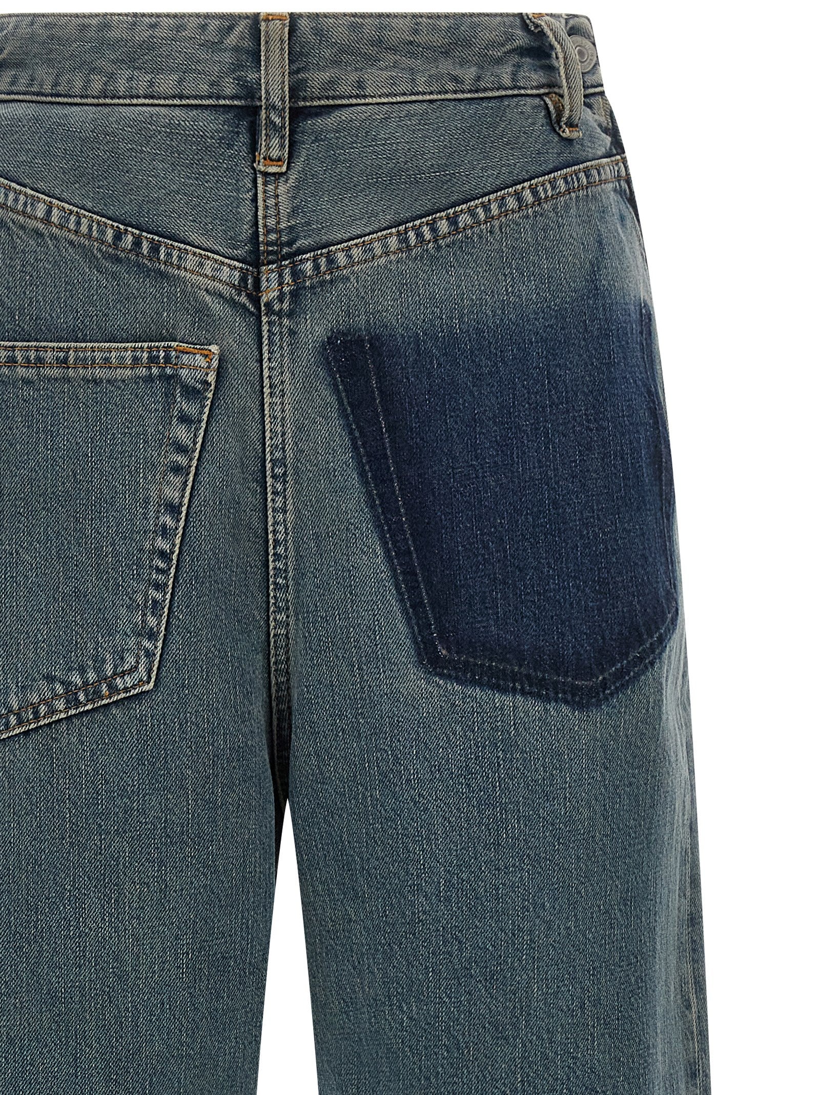 Indulge in the artistry of MM6 Maison Margiela's Blue Cotton Jeans, where innovative design meets luxurious craftsmanship for a statement of contemporary elegance.