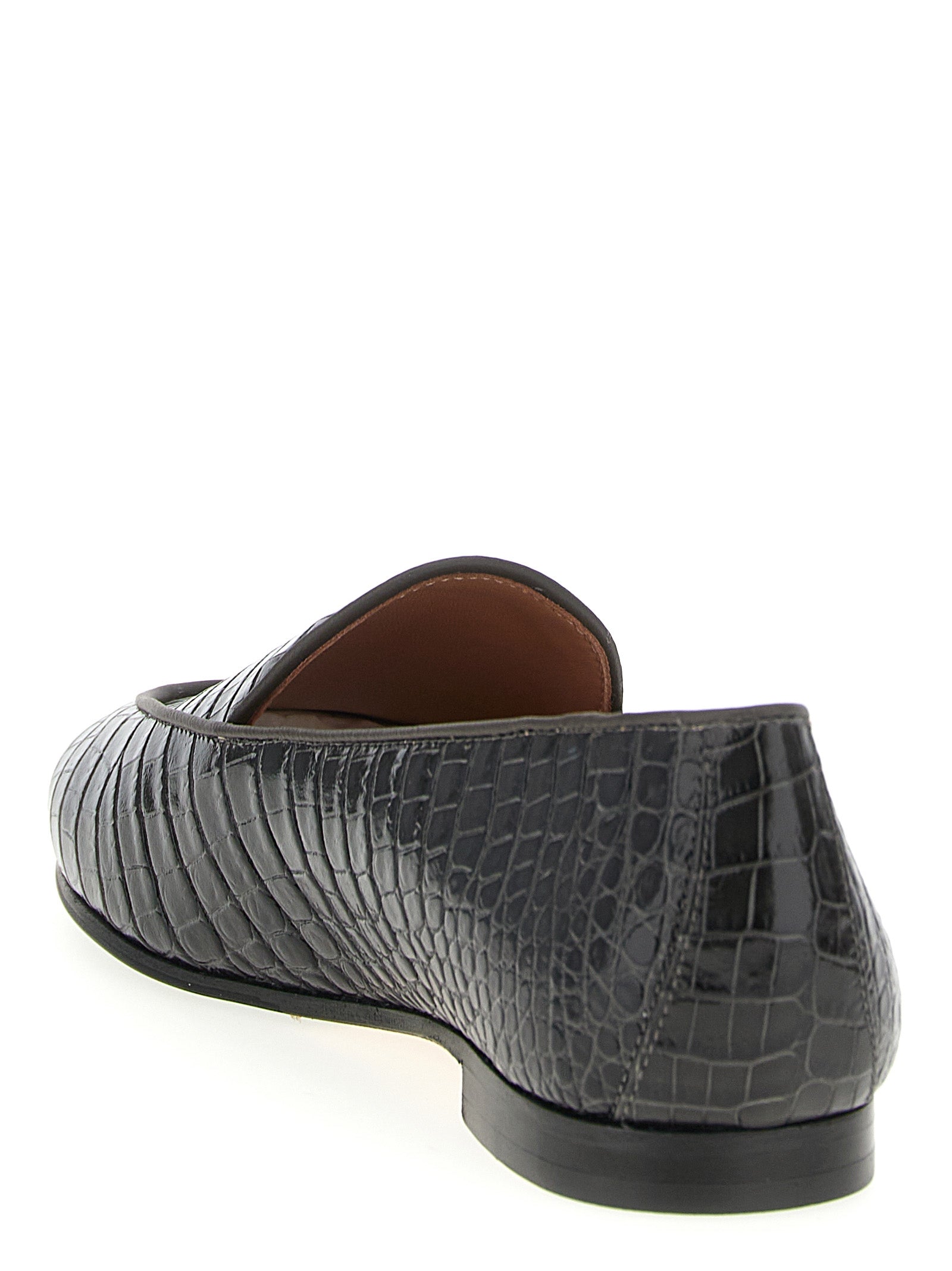 Elevate your style with Aquazzura Black Calfskin Slip-On Loafers, where Italian craftsmanship meets timeless elegance, perfect for the discerning individual.