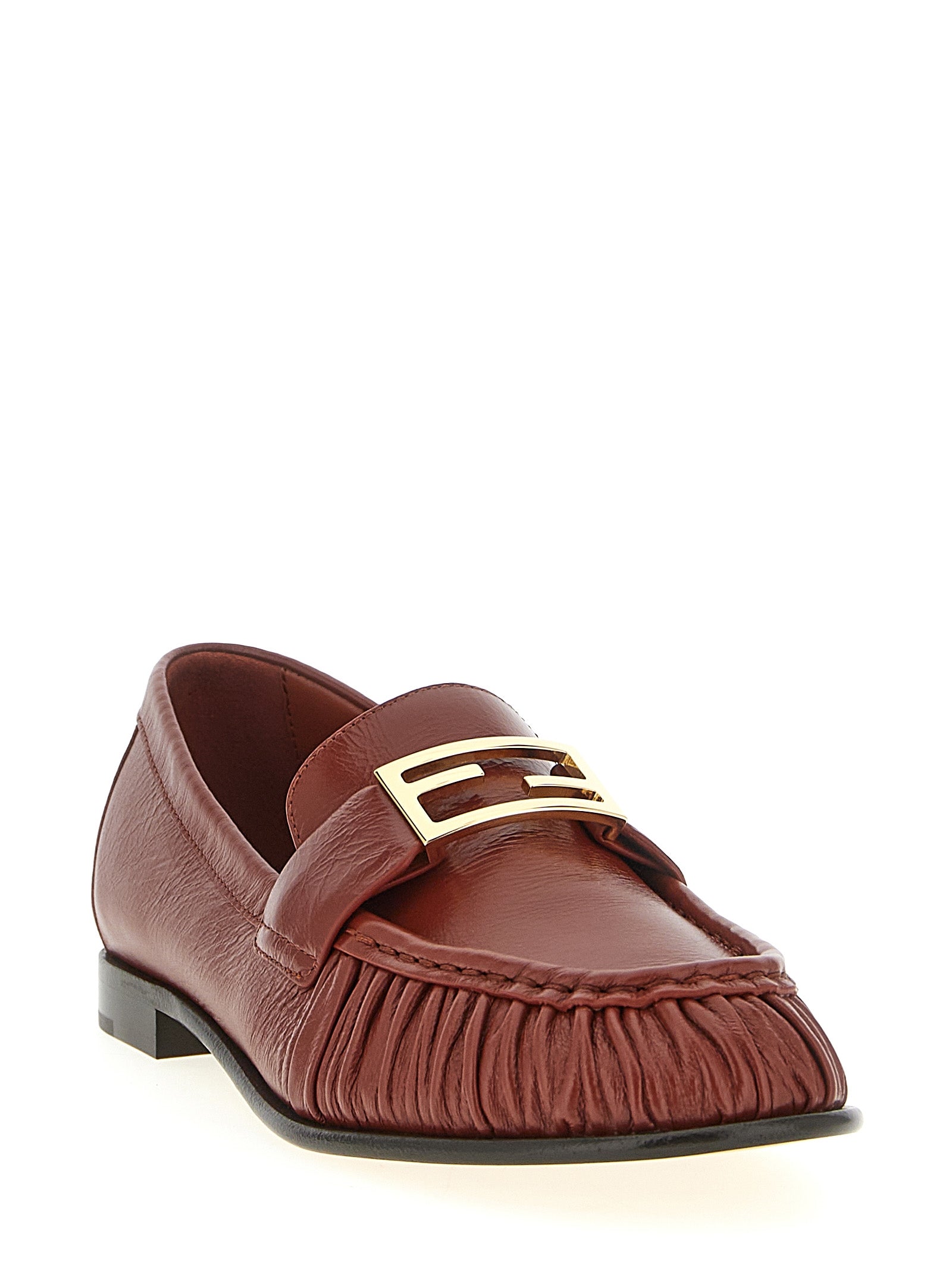 Elevate your elegance with Fendi's Brown Lamb Leather Slip-On Loafers, where artisanal craftsmanship meets iconic design for a luxurious statement in any setting.