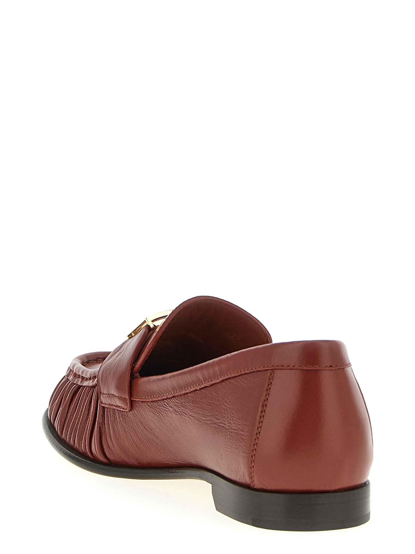 Indulge in the exquisite Fendi Brown Lamb Leather Slip-On Loafers, where artisanal craftsmanship meets timeless elegance, perfect for the discerning connoisseur.