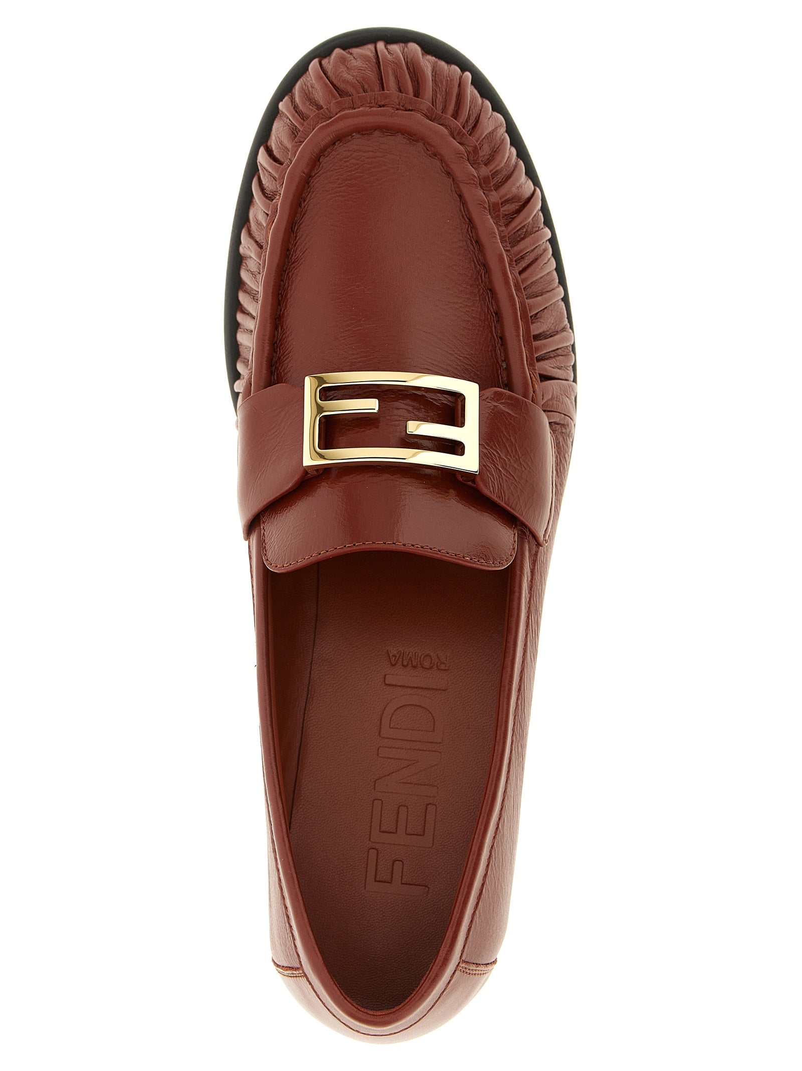 Experience the allure of Fendi's Brown Lamb Leather Slip-On Loafers, where artisanal craftsmanship meets timeless elegance, perfect for the discerning individual.