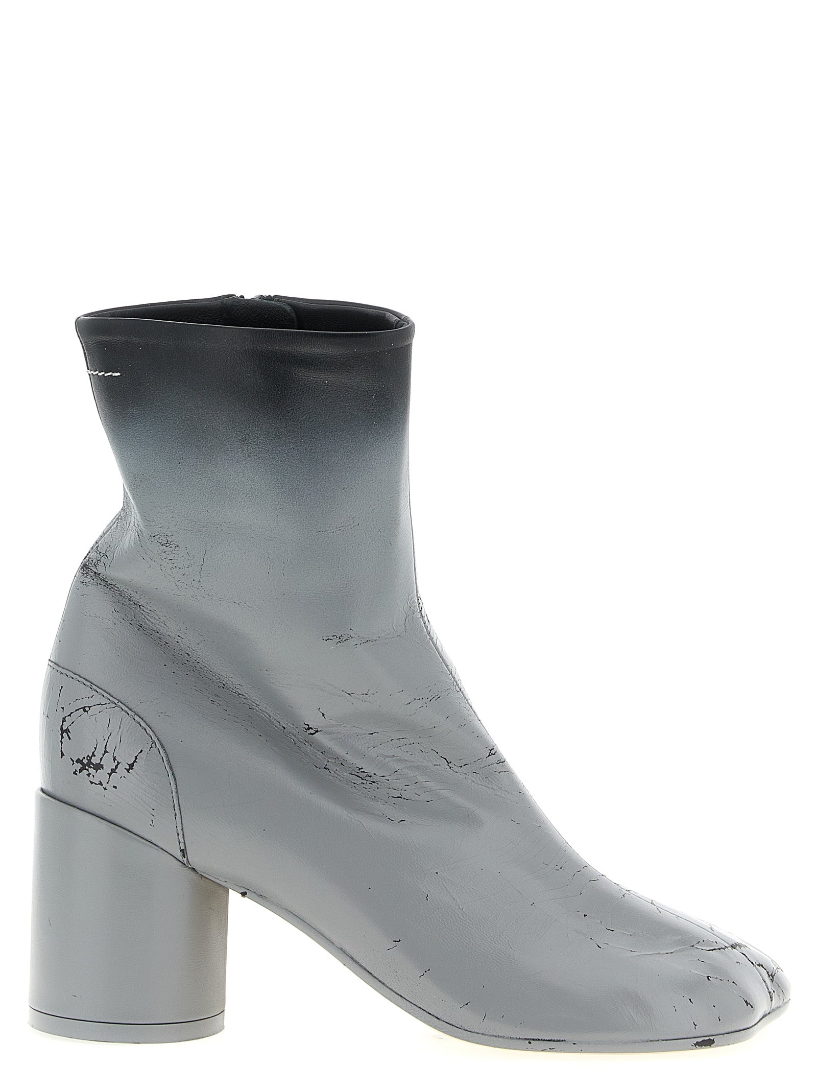 Discover the MM6 Maison Margiela Gray Lambskin Ankle Boots, where avant-garde design meets luxurious craftsmanship, elevating your style with every step.