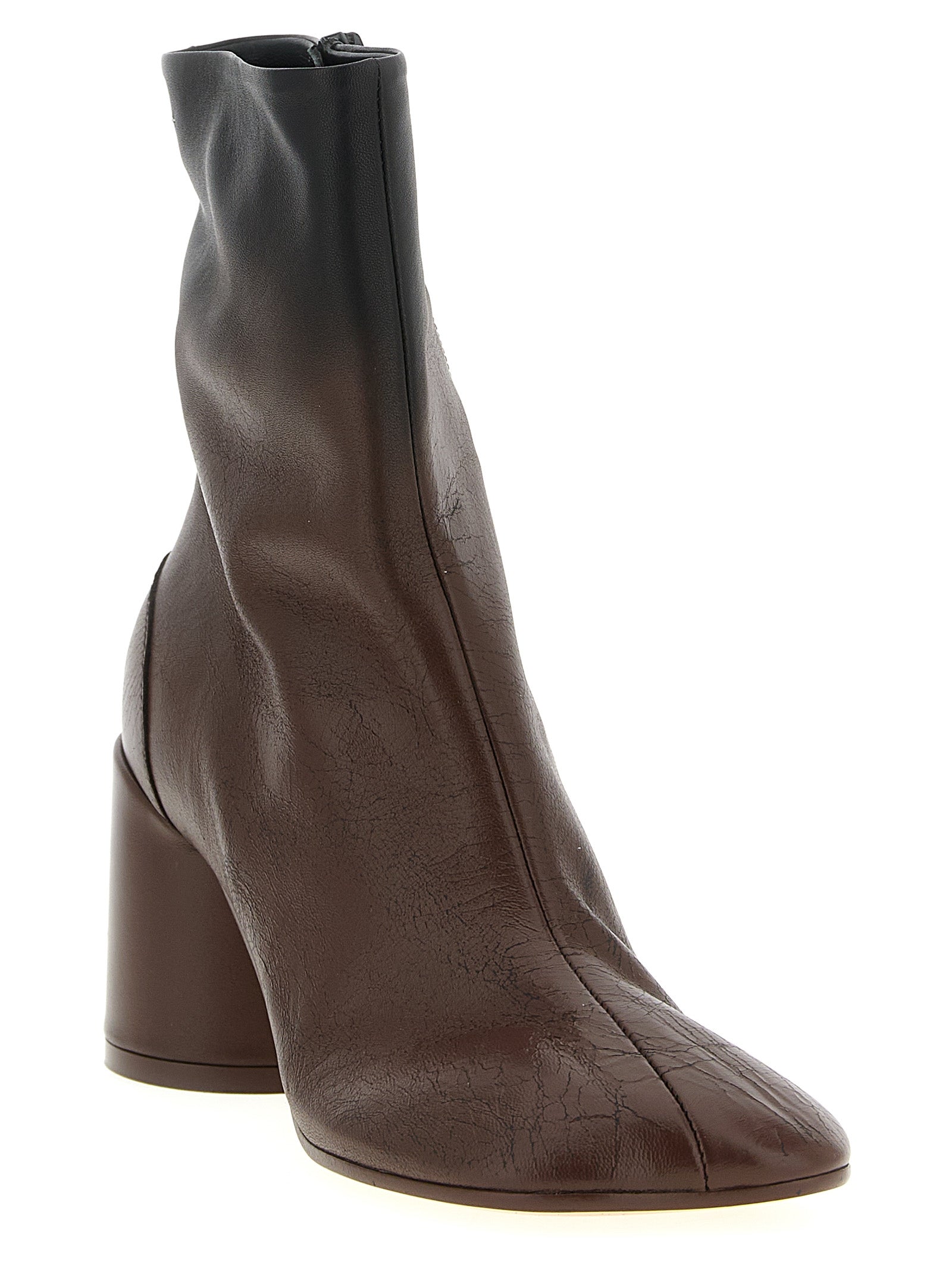 Step into unparalleled elegance with MM6 Maison Margiela's Brown Lambskin Ankle Boots, where artisanal craftsmanship meets avant-garde design for a timeless statement.