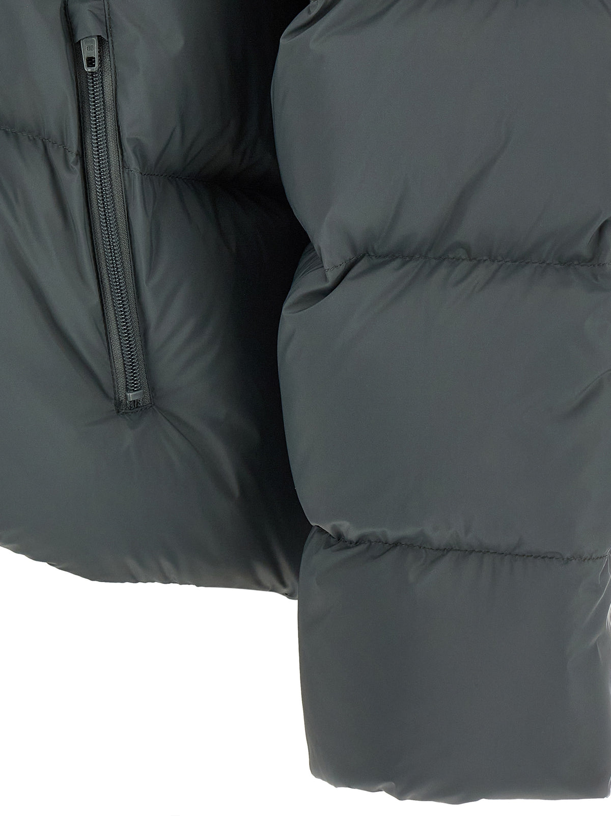 Indulge in the Balenciaga Gray Polyamide Full-Length Jacket, a masterpiece of Italian craftsmanship that redefines luxury outerwear with its exquisite design and versatile elegance.