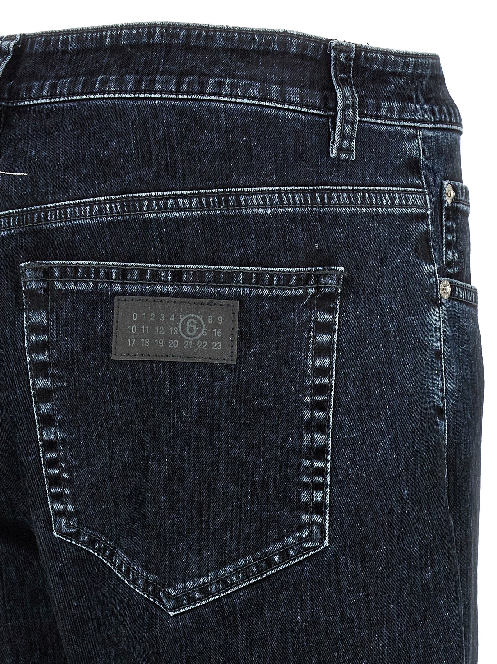 Elevate your wardrobe with MM6 Maison Margiela's Black Cotton Straight-Leg Jeans, where exquisite craftsmanship meets timeless elegance for the discerning individual.