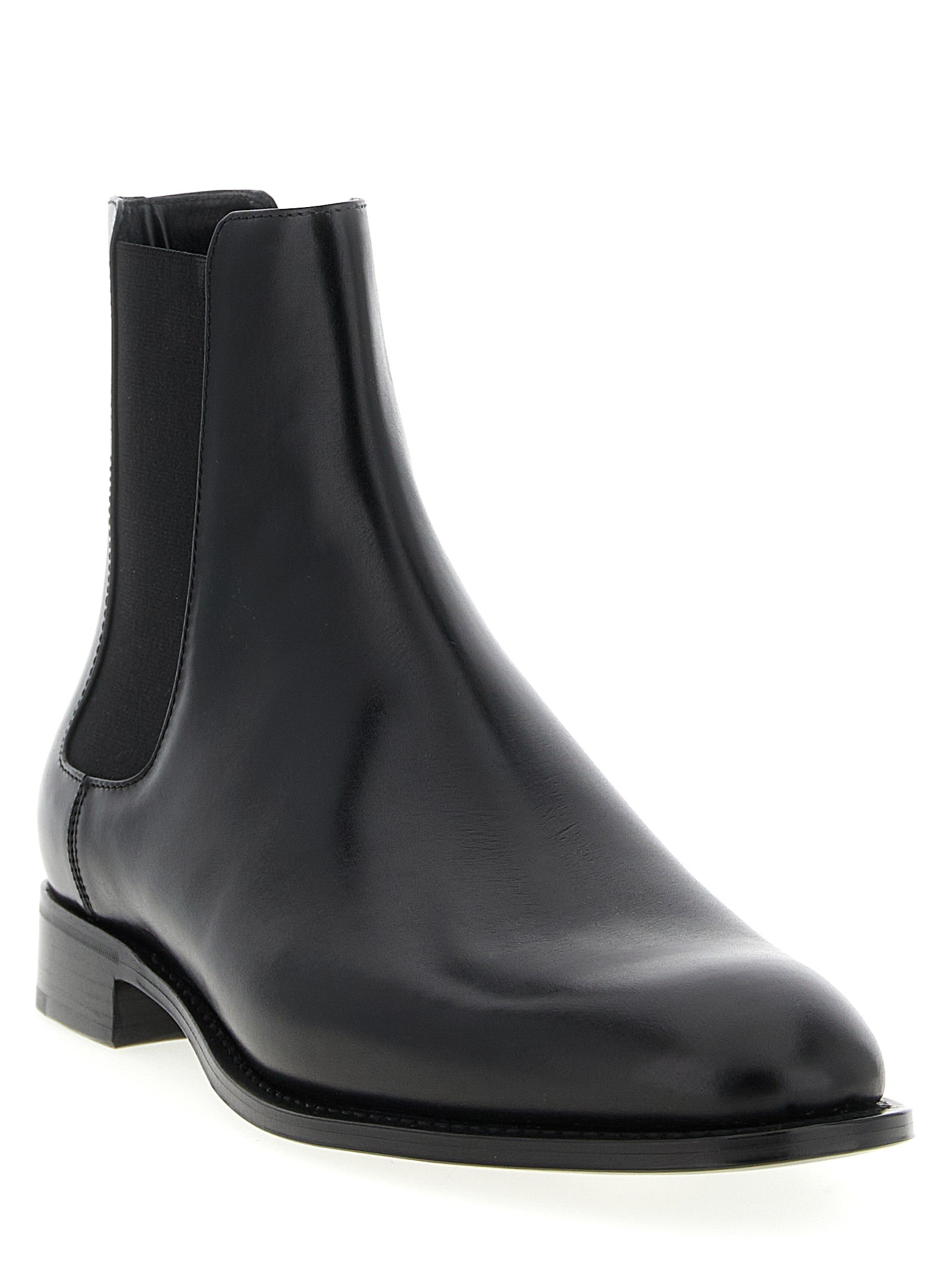 Step into timeless elegance with Saint Laurent's Black Calfskin Chelsea Boots, where exquisite craftsmanship and luxurious materials redefine sophistication for the discerning individual.