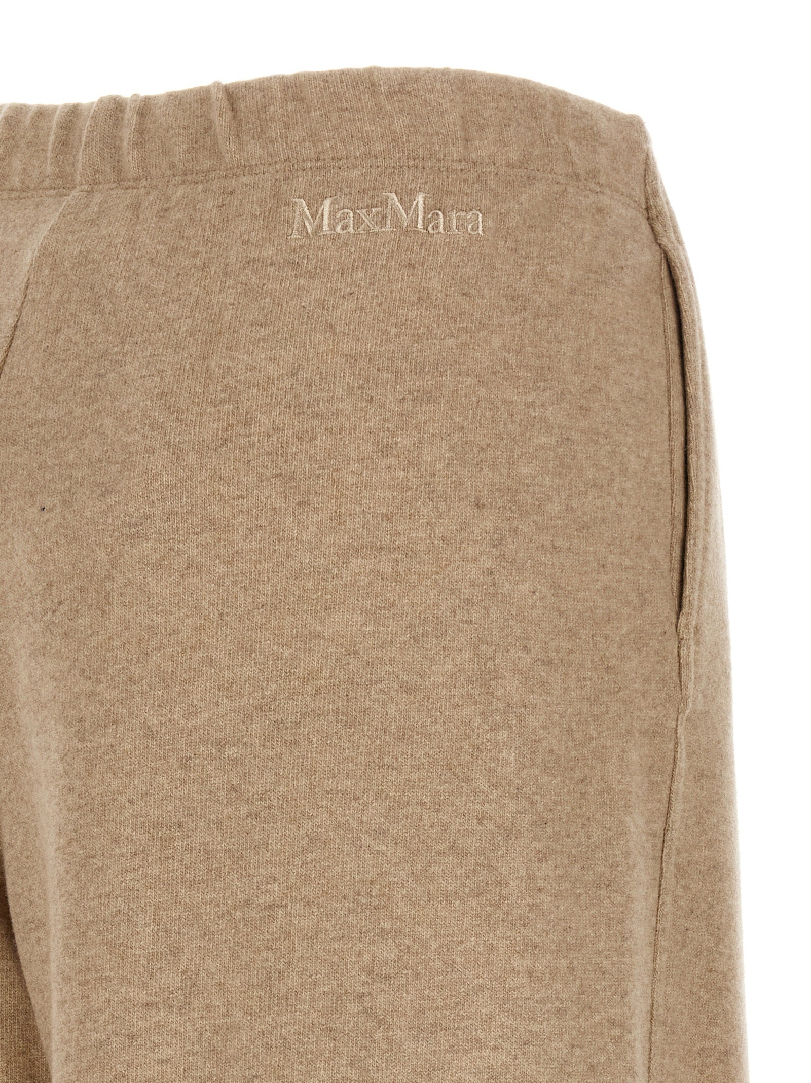 Experience the allure of Max Mara's Beige Cashmere Casual Pants, crafted from luxurious cashmere for unparalleled elegance and comfort in every moment.