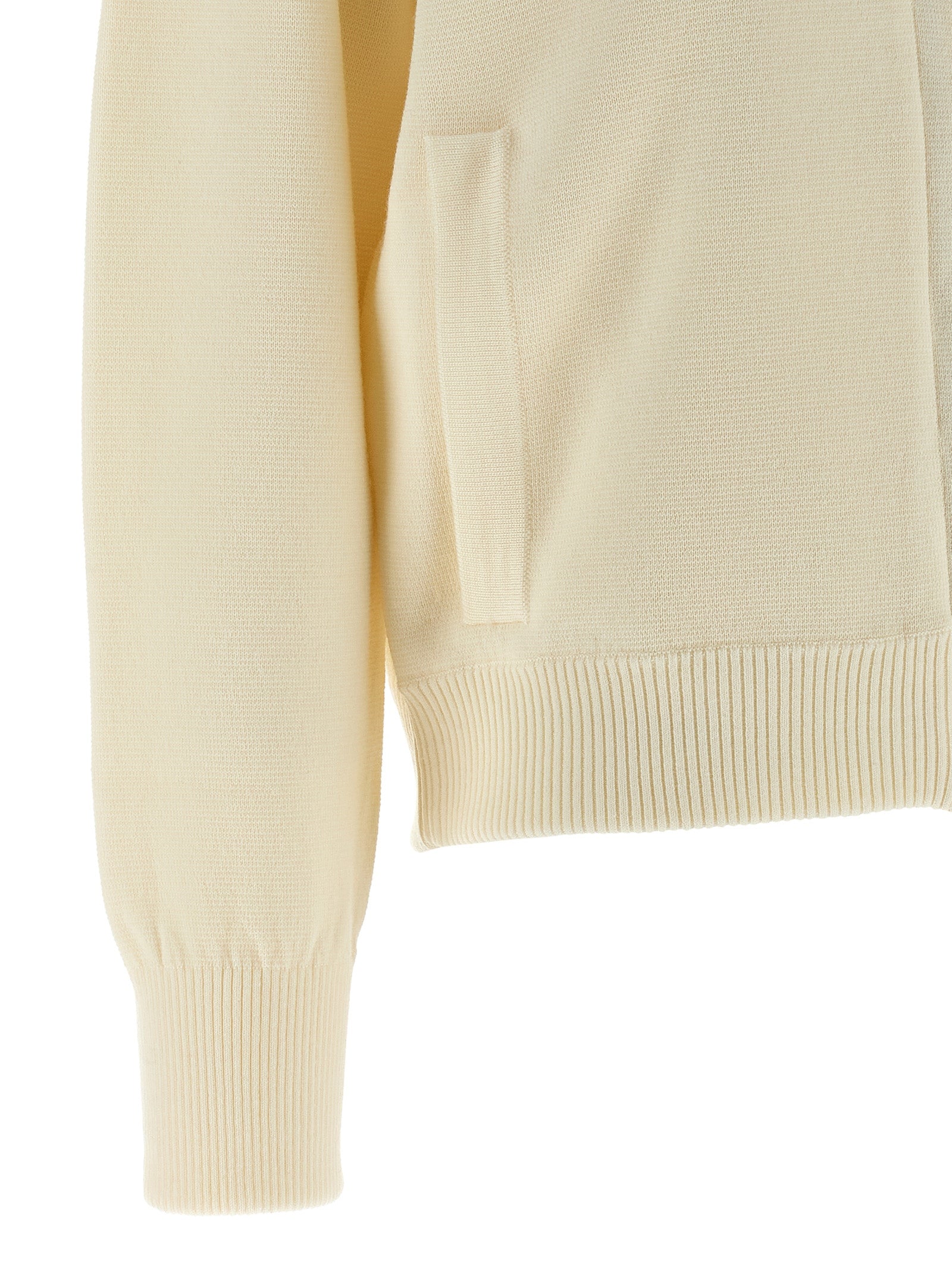 Experience the sublime elegance of the Max Mara White Virgin Wool Cardigan, a timeless piece crafted from luxurious virgin wool, perfect for sophisticated wardrobes.
