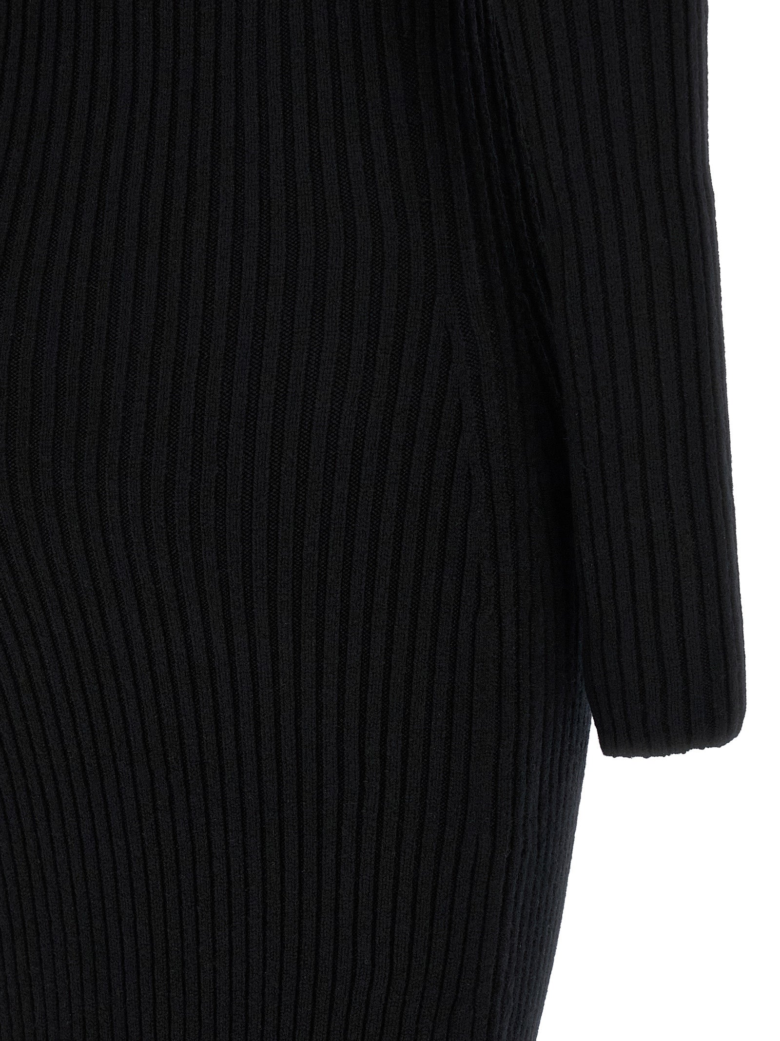 Experience the allure of the Max Mara Black Wool Long Dress, a luxurious blend of wool and cashmere that redefines elegance for every sophisticated occasion.