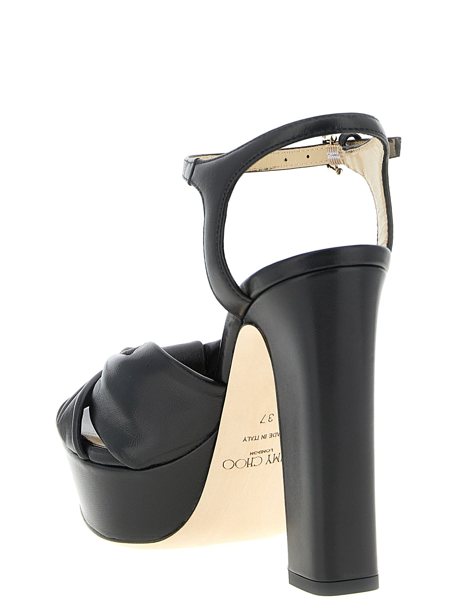 Step into the world of artisanal luxury with Jimmy Choo's Heloise sandals, crafted in Italy from premium materials for unparalleled elegance and comfort.