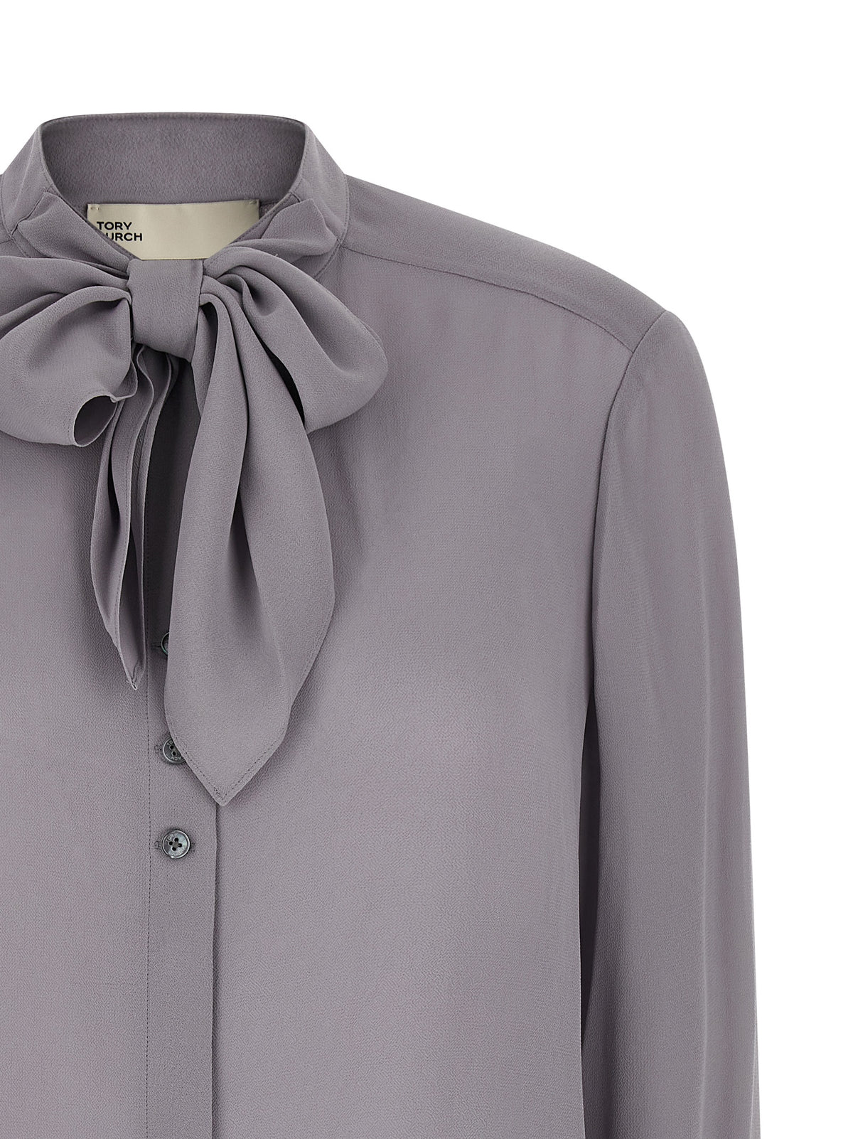 Indulge in the Tory Burch Gray Viscose Blouse, a masterpiece of luxurious craftsmanship, where refined elegance meets effortless sophistication for every occasion.