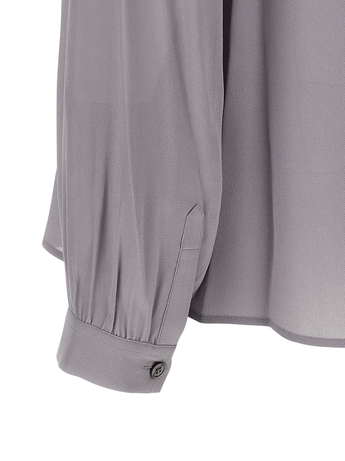 Indulge in the Tory Burch Gray Viscose Blouse, a masterpiece of luxurious craftsmanship that embodies elegance and sophistication for any refined occasion.