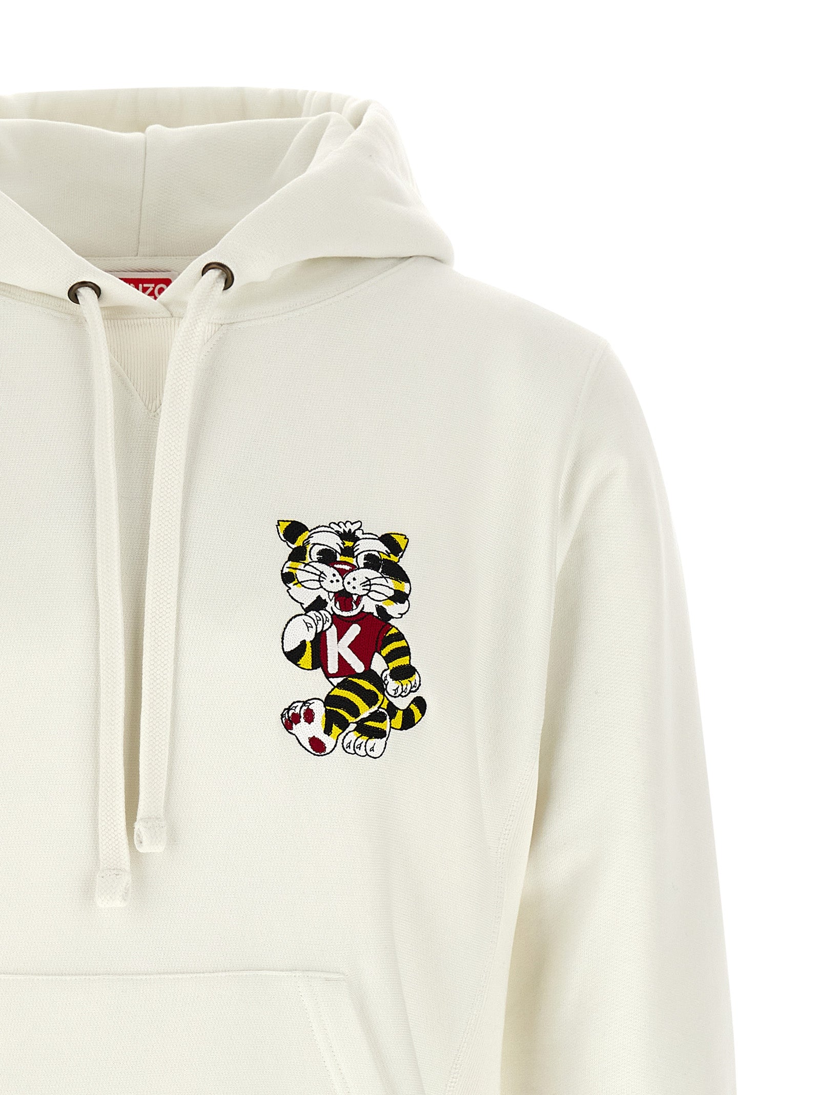 Indulge in the artistry of the Kenzo White Cotton Sweatshirt, where luxurious cotton meets bold tiger embroidery, perfect for those who embrace elegance and individuality.
