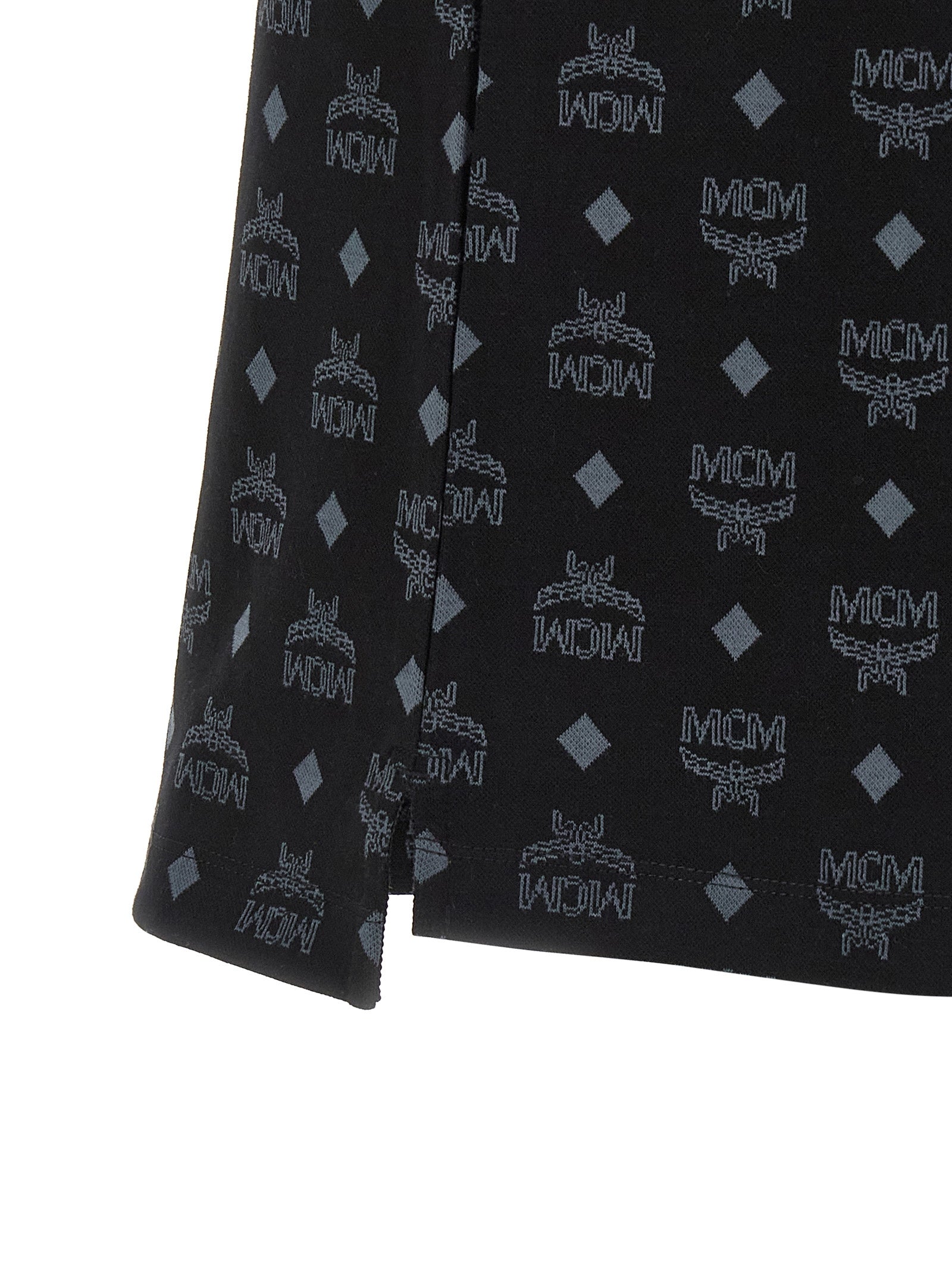 Elevate your wardrobe with the MCM Black Cotton Polo Shirt, a testament to artisanal luxury and contemporary design, crafted from premium cotton for the discerning individual.