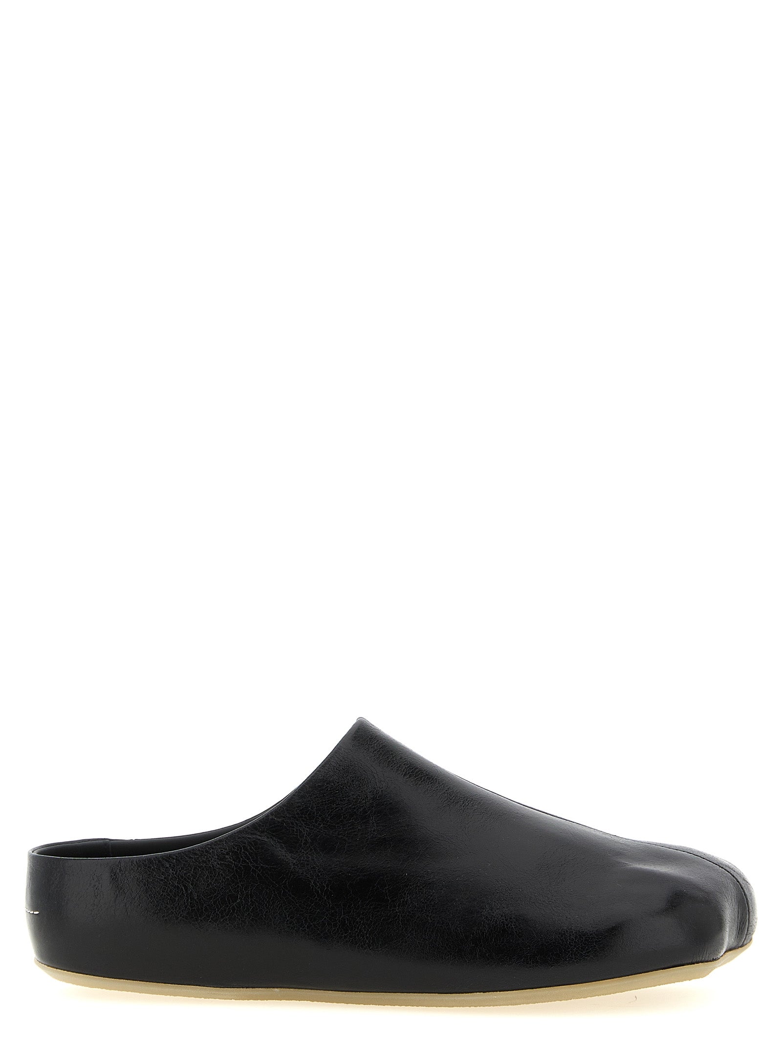 Step into luxury with MM6 Maison Margiela Black Calfskin Clogs, where exquisite craftsmanship and avant-garde design redefine sophistication for the discerning individual.