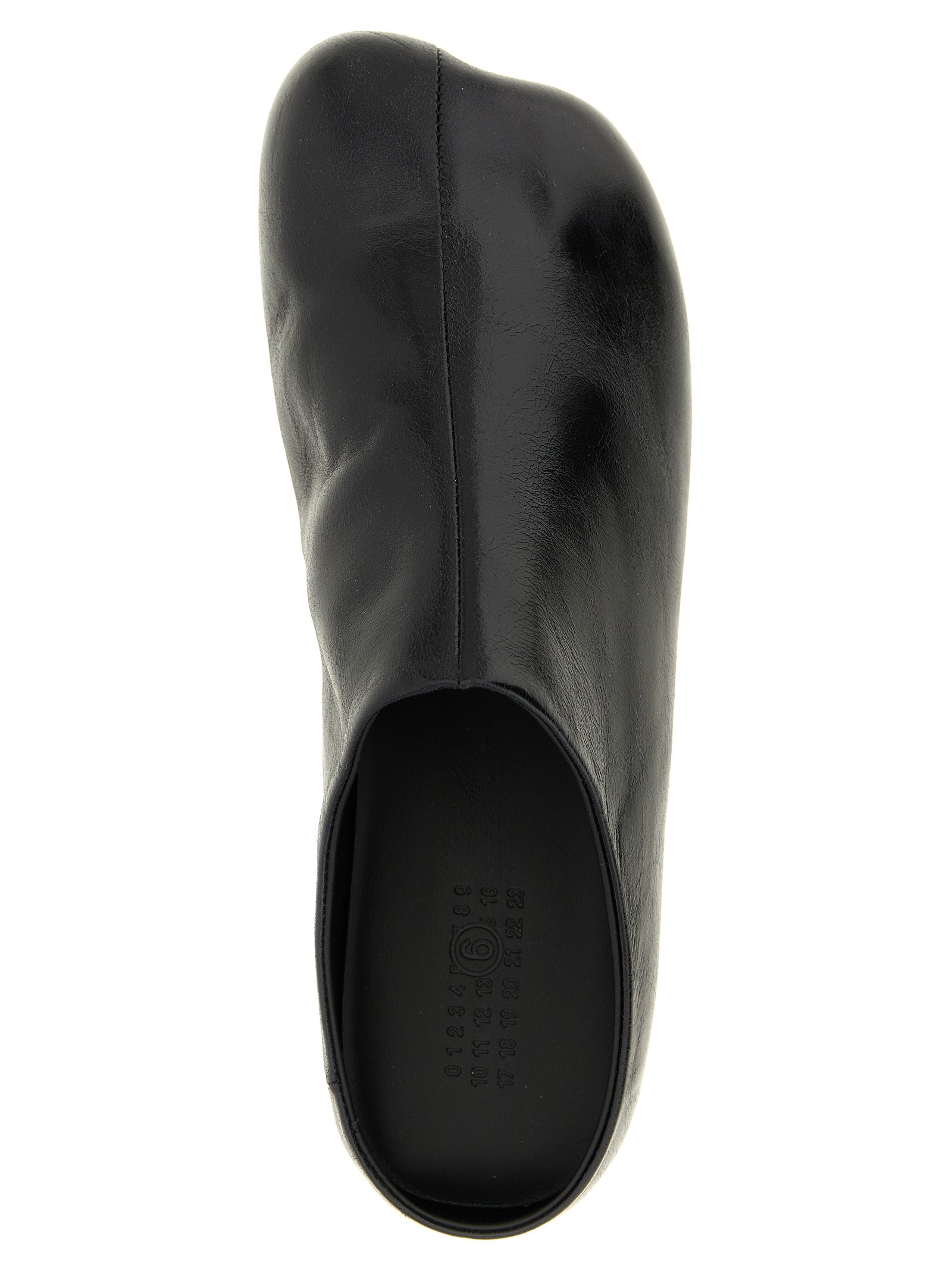 Step into elegance with MM6 Maison Margiela Black Calfskin Clogs, where artisanal luxury meets avant-garde design, perfect for the discerning individual.