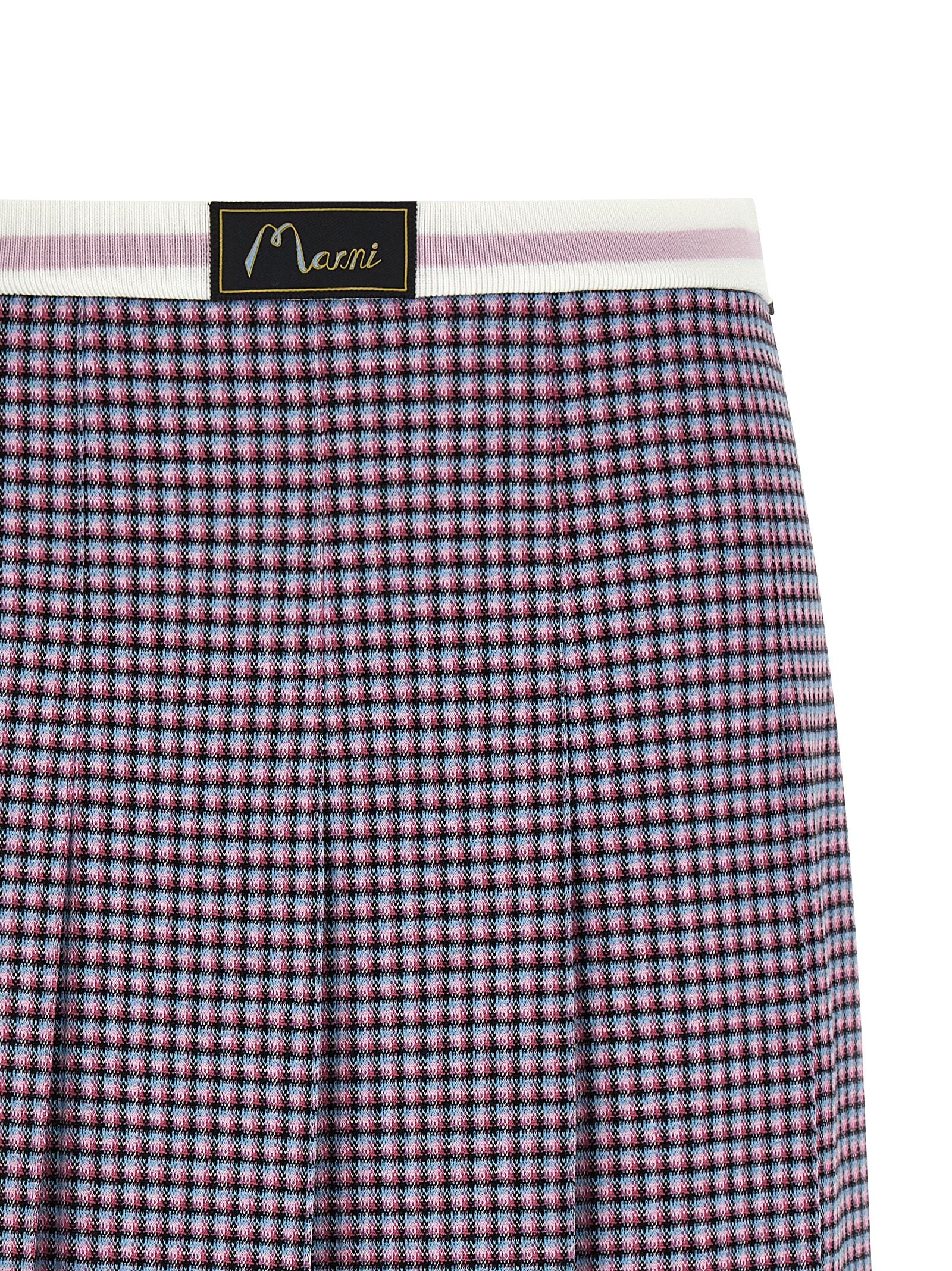 Indulge in the Marni Purple Viscose Long Skirt, a masterpiece of luxurious craftsmanship and timeless elegance, perfect for elevating any sophisticated wardrobe.