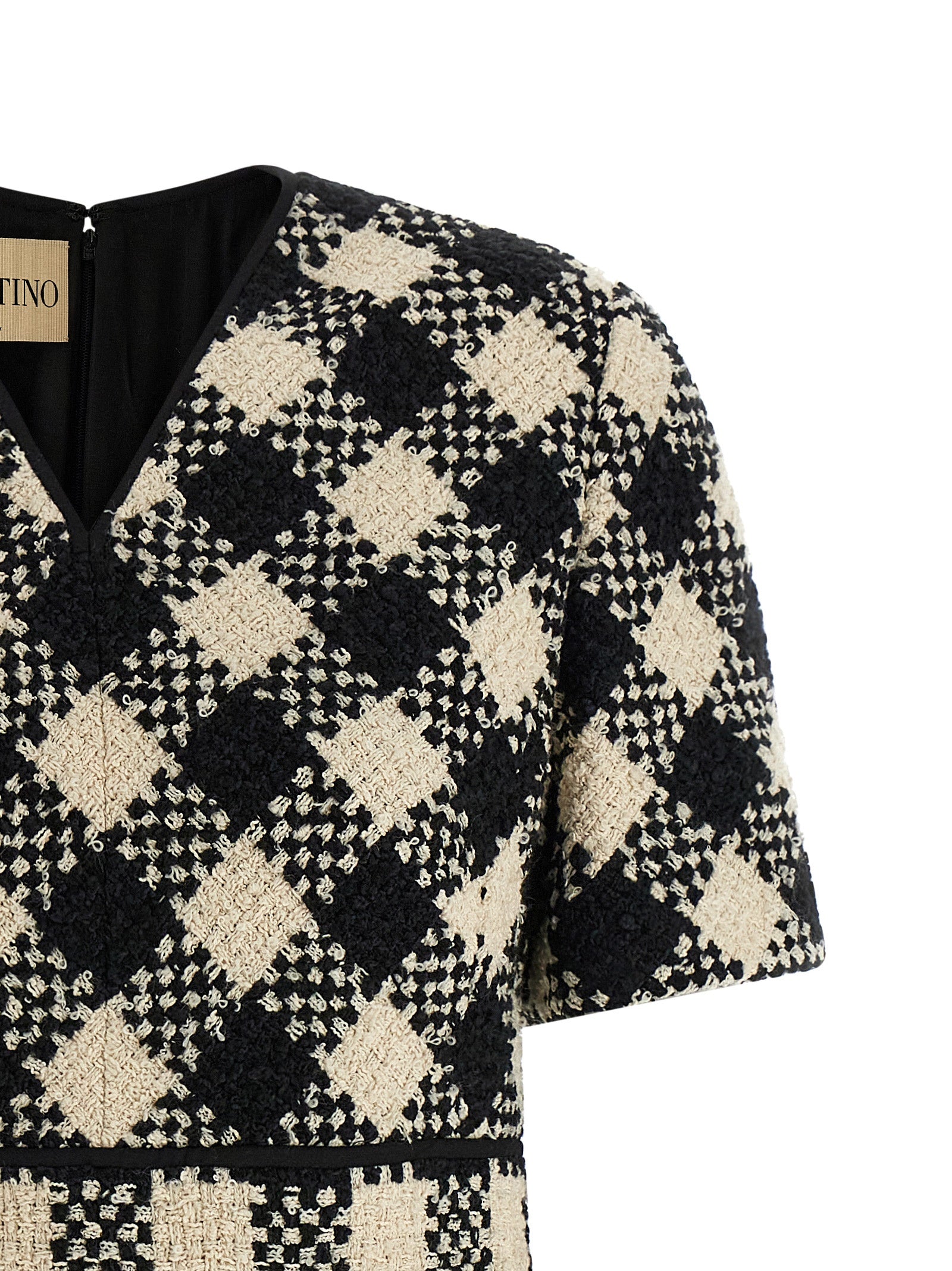 Indulge in the exquisite craftsmanship of the Valentino Garavani Bicolor Cotton Short Dress, where luxurious materials meet a flattering silhouette for timeless elegance.