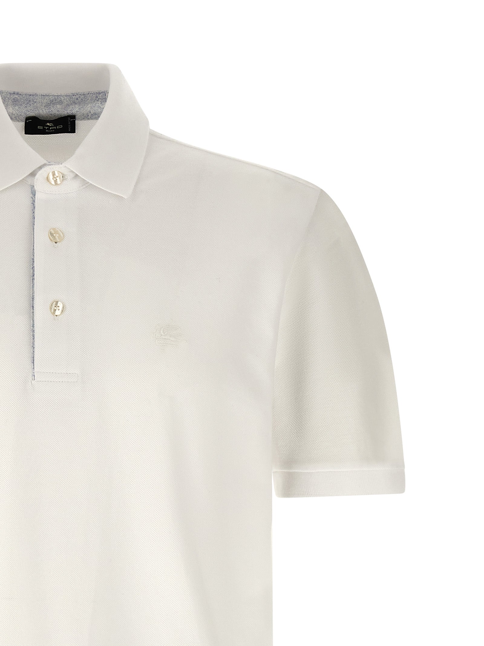 Elevate your wardrobe with the Etro White Cotton Polo Shirt, a masterpiece of Italian craftsmanship that embodies timeless elegance and effortless sophistication.