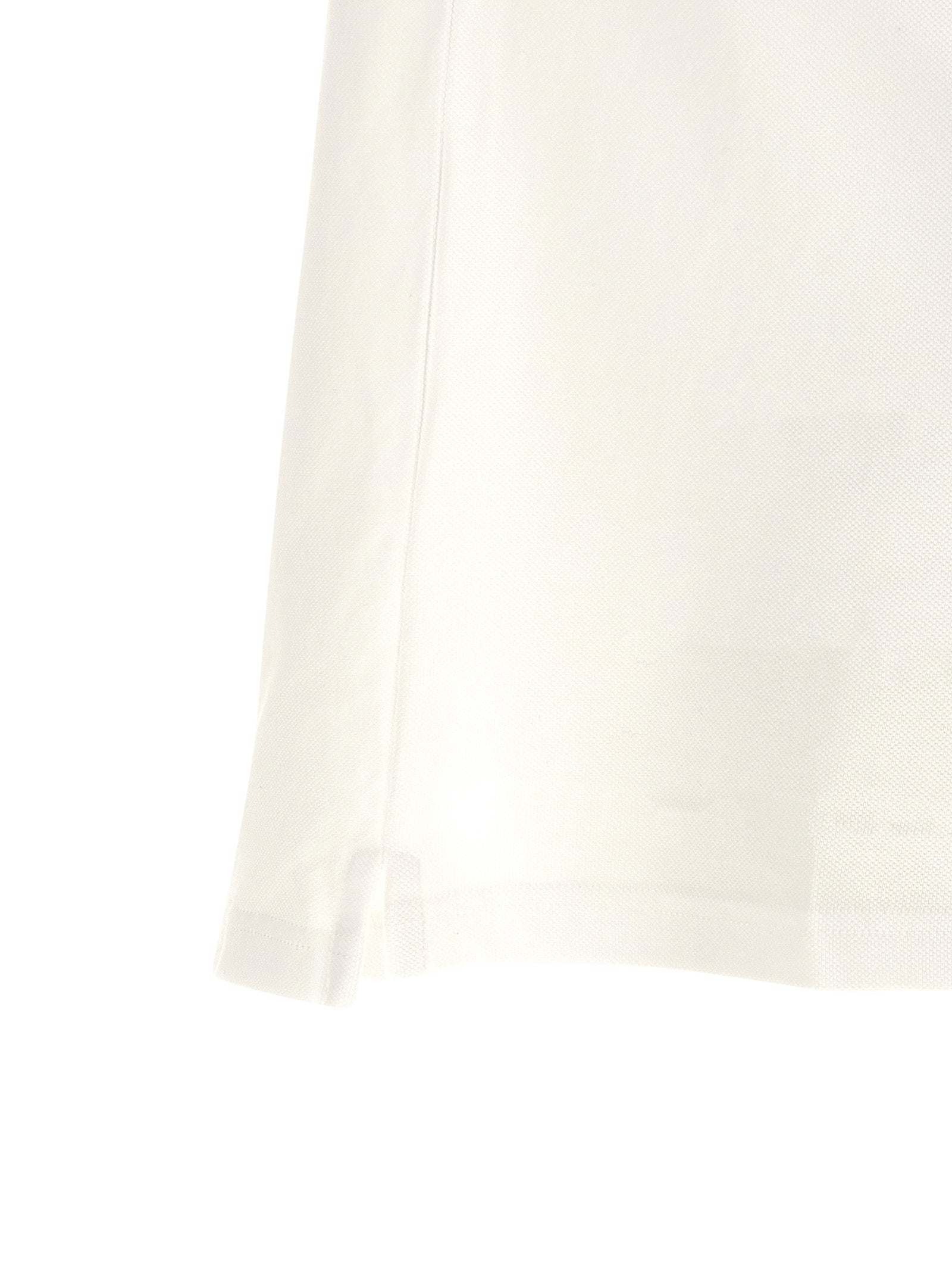 Elevate your style with the Etro White Cotton Polo Shirt, a masterpiece of Italian craftsmanship, blending luxury and comfort for the discerning individual.