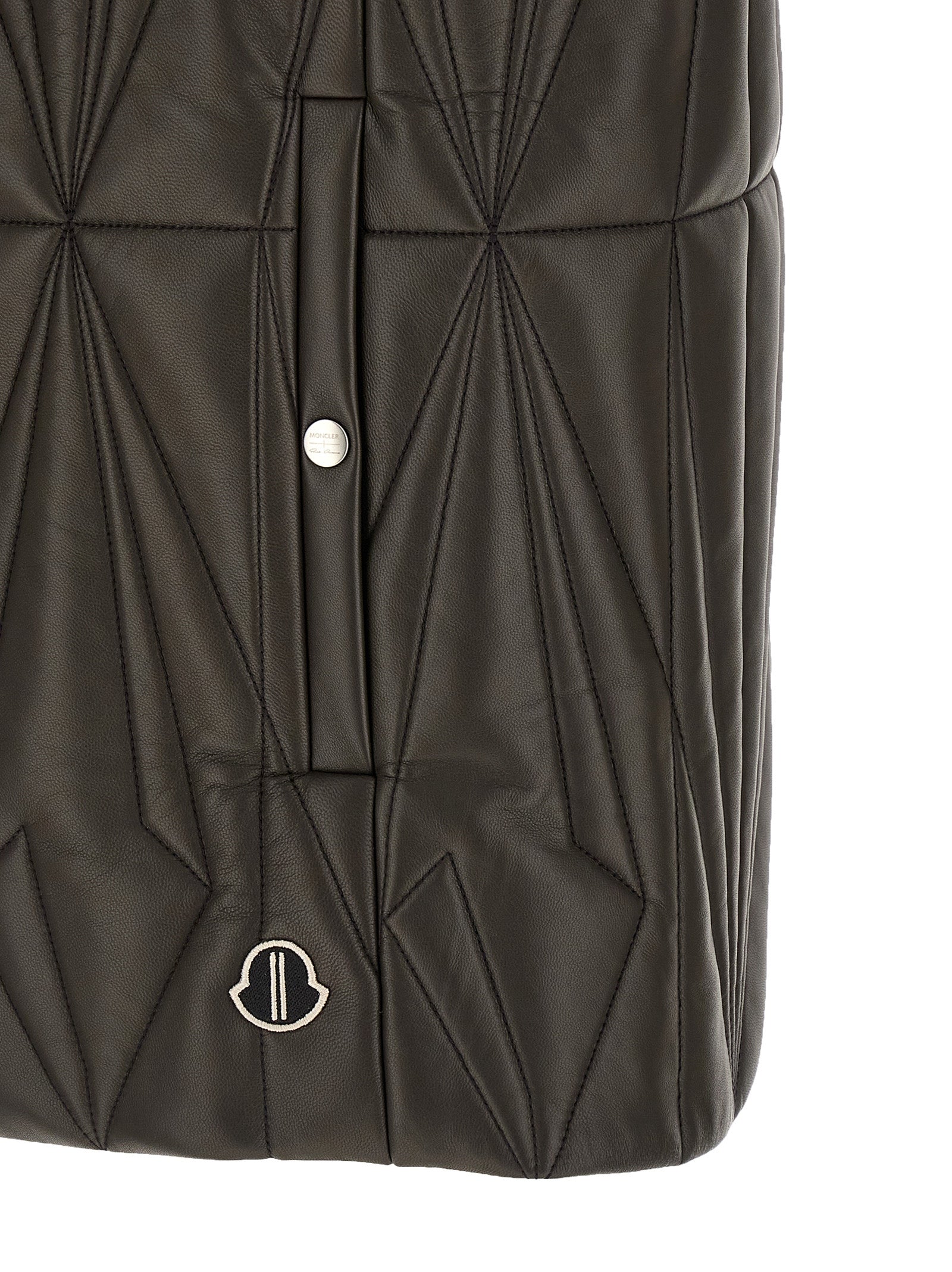 Elevate your wardrobe with the RICK OWENS x Moncler Geocamo Flight sleeveless jacket, crafted from sumptuous lamb leather, embodying luxury and modern elegance.