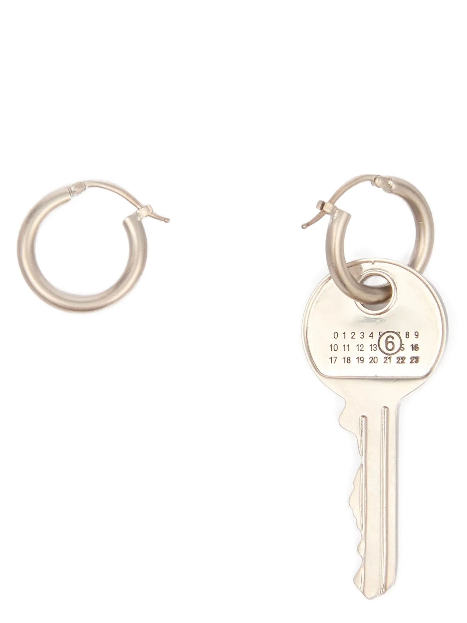 Discover the exquisite MM6 Maison Margiela Silver Brass Earrings, where luxurious craftsmanship meets vintage allure, perfect for those who embody elegance and confidence.