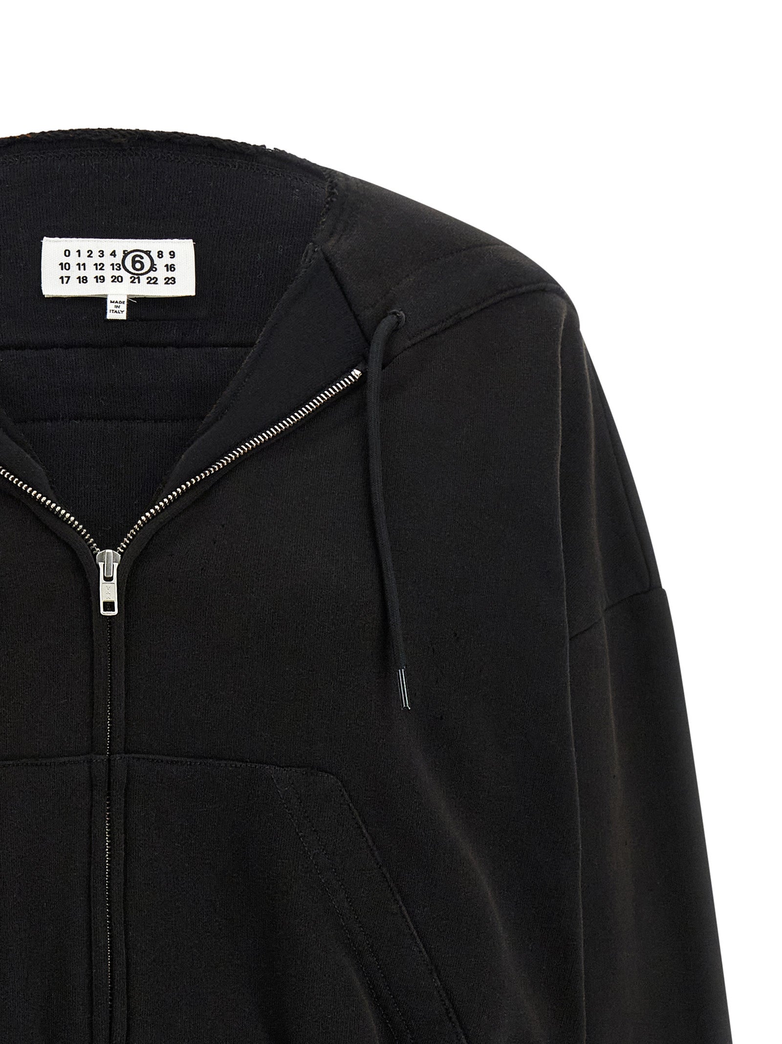Indulge in the avant-garde elegance of the MM6 Maison Margiela Black Cotton Sweatshirt, where artisanal luxury meets rebellious sophistication for a statement-making allure.