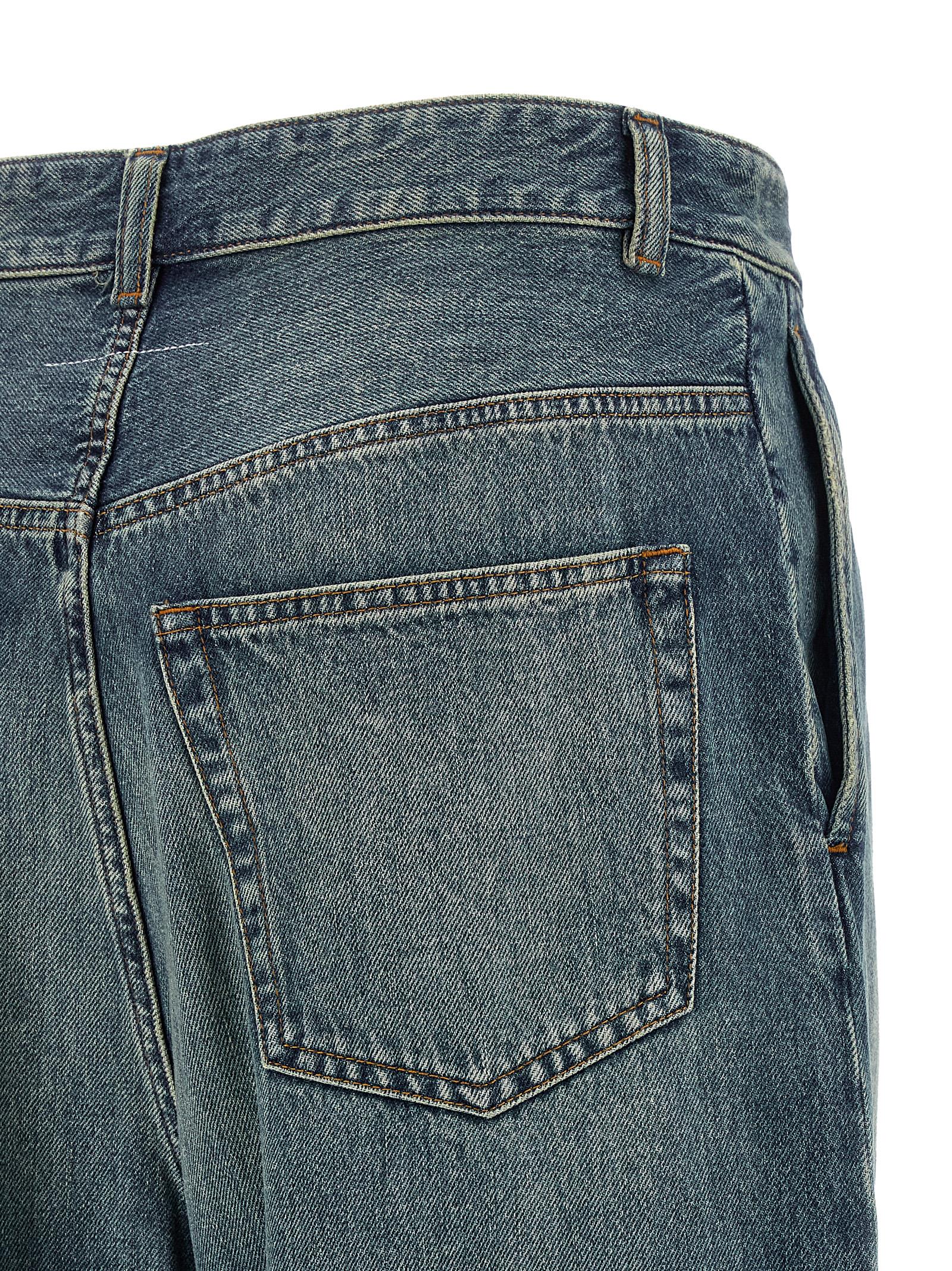 Elevate your style with MM6 Maison Margiela's Stonewashed Denim Jeans, where avant-garde design meets luxurious craftsmanship, perfect for the discerning fashion connoisseur.