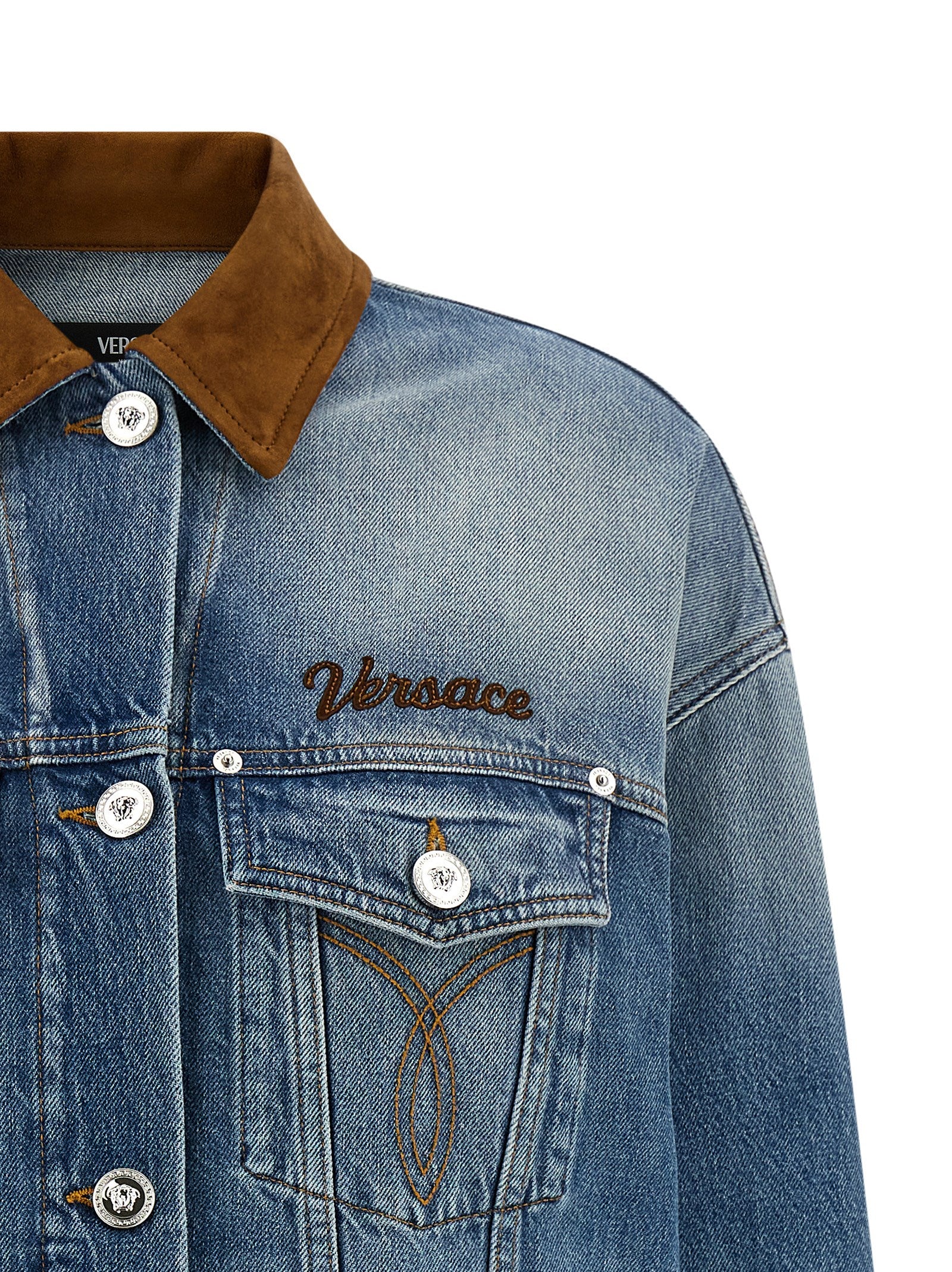 Elevate your style with the Versace Blue Cotton Denim Jacket, a luxurious blend of artisanal craftsmanship and timeless elegance, perfect for the discerning fashionista.