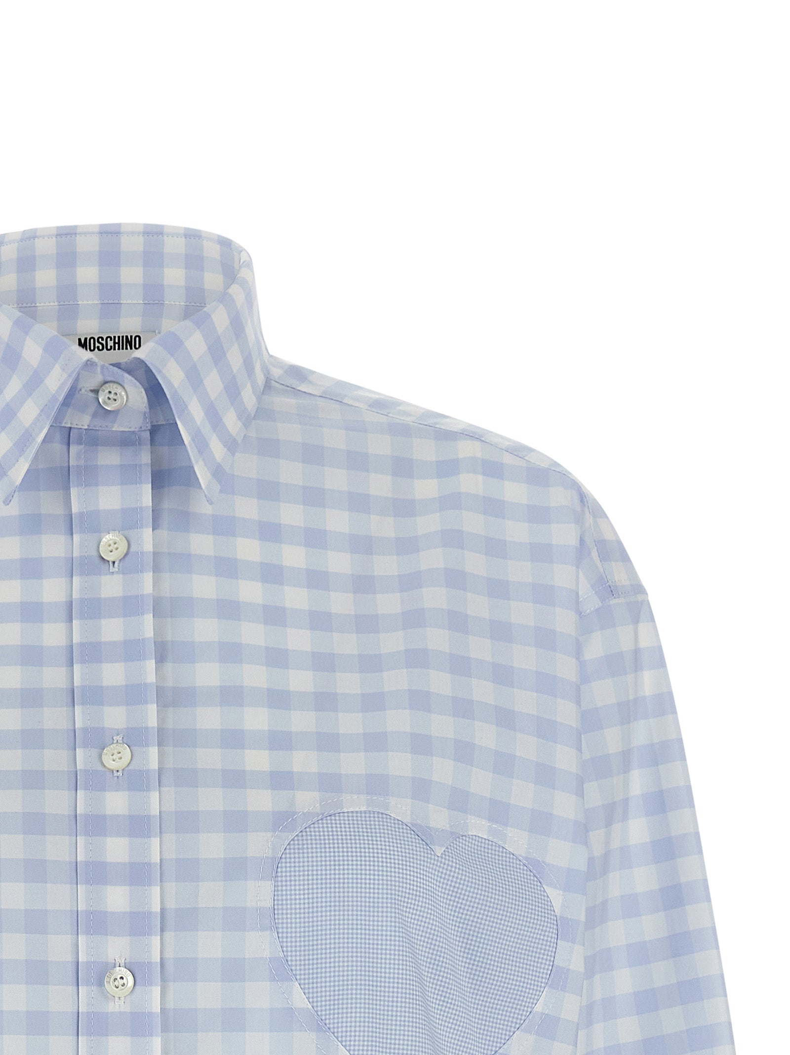 Discover the Moschino Blue Cotton Blouse, a masterpiece of Italian craftsmanship featuring a delicate micro vichy pattern and heart patch, embodying luxury and elegance.