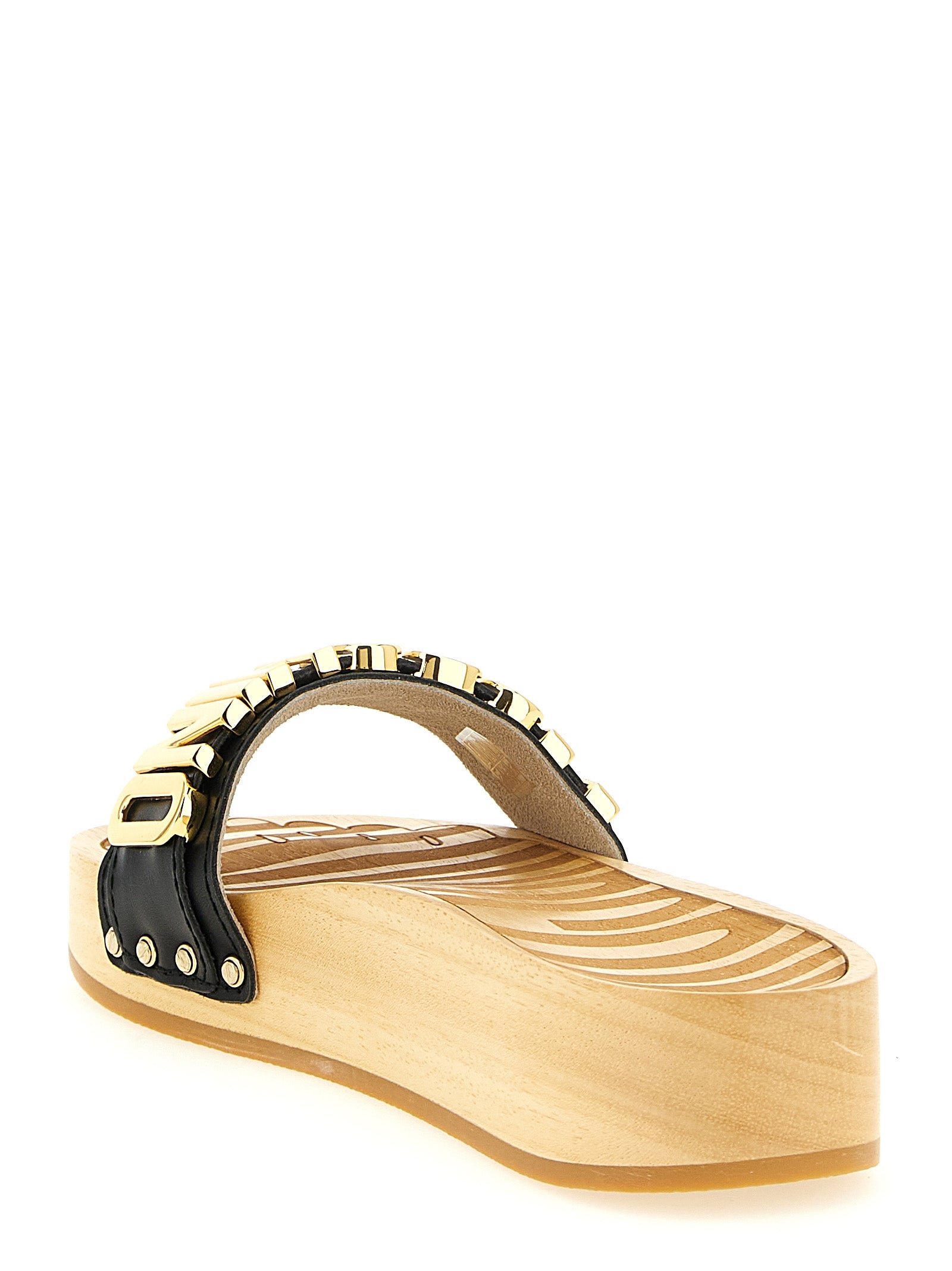 Elevate your style with Moschino Black Calfskin Slides, crafted from luxurious calfskin leather, blending elegance and comfort for the discerning individual.